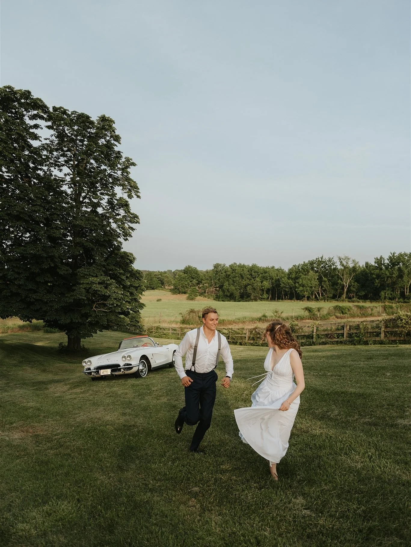 Barefoot in the grass, a summer breeze catching her dress, and golden light spilling across the fields. The hottest day of the year yet everything about them felt easy, unhurried and full of grace, love unfolding as naturally as the landscape around 
