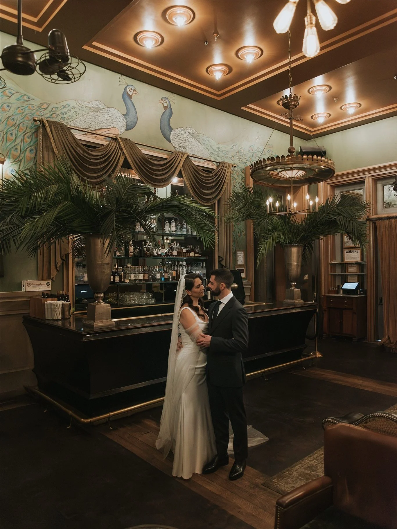 A day that danced between heritage and art.
Phillipa &amp; Artie at The Grand Soho Hotel
The morning was calm and tender, as they prepared together.

Then came the final touches, writing her single friends&rsquo; names beneath her shoe, well wishes f