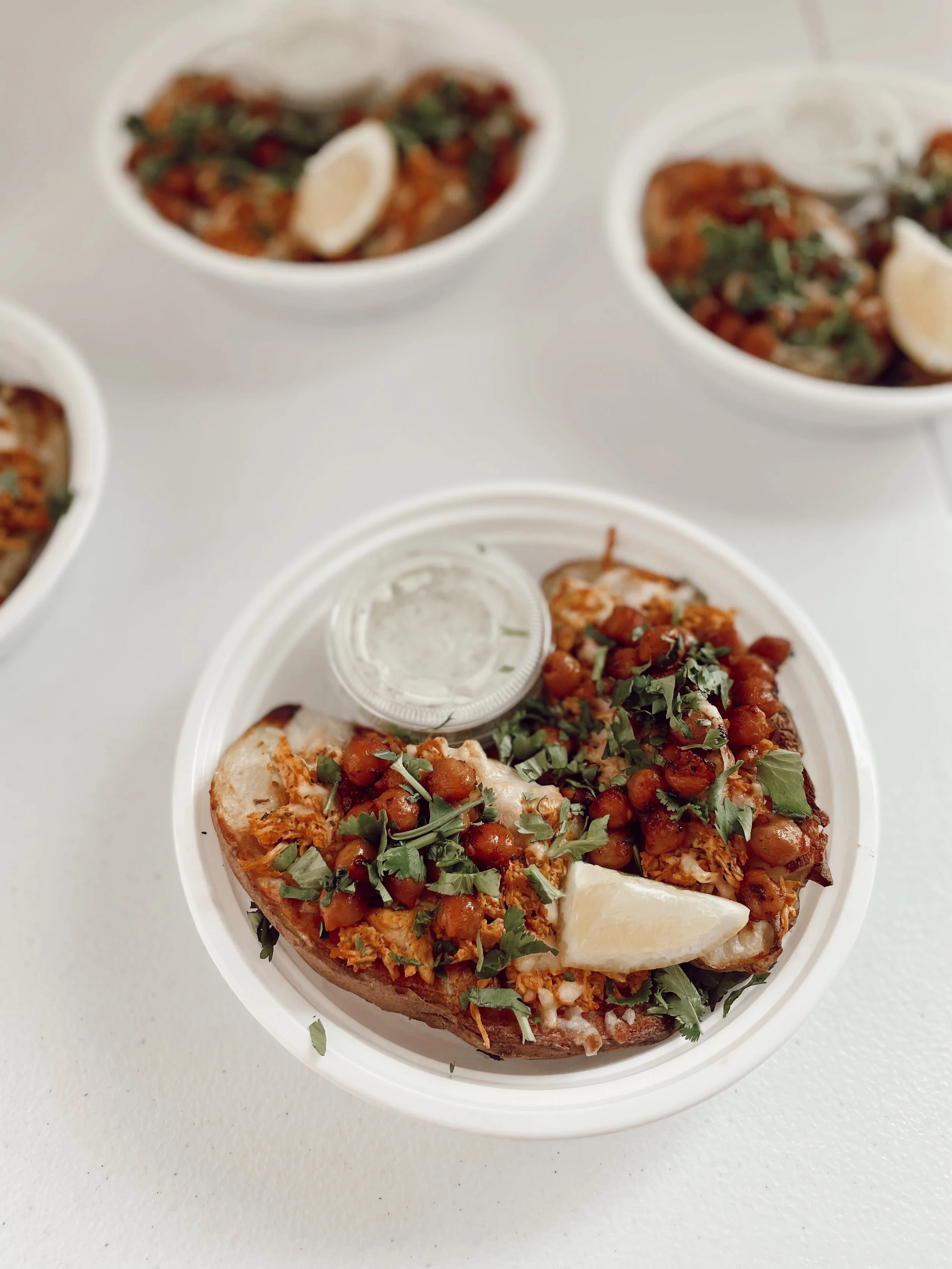 Moroccan Chicken Stuffed Potatoes with Crispy Chickpeas and Green Goddess Sauce