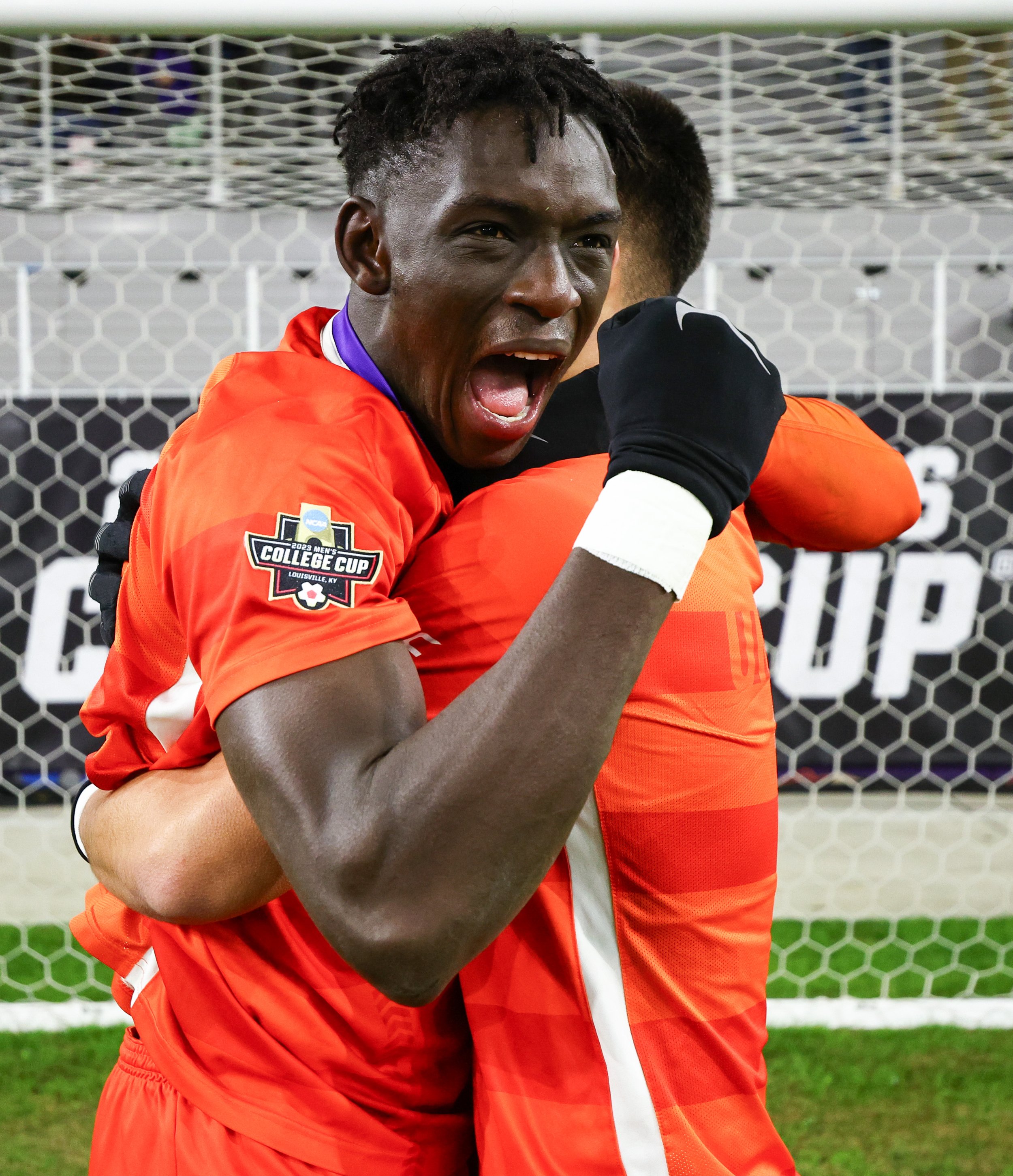  LOUISVILLE, KENTUCKY - DECEMBER 11: Pape Mar Boye #2 and Mason Jimenez #16 of the Clemson Tigers celebrates after beating the Notre Dame Fighting Irish for the Division I Men’s Soccer Championship held at the Lynn Family Stadium on December 11, 2023