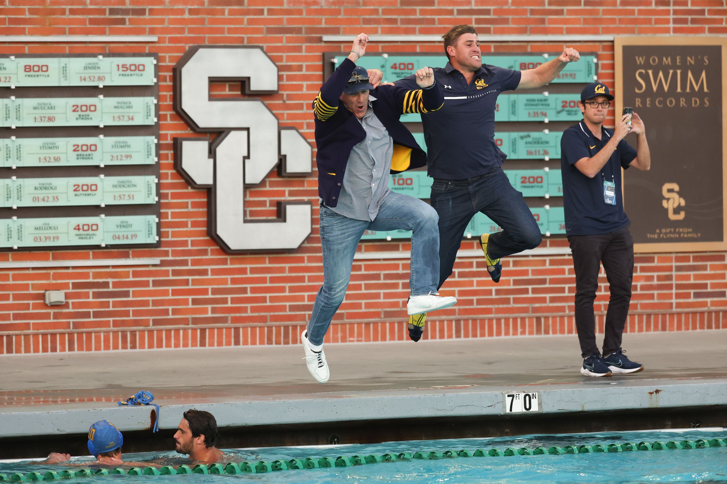  LOS ANGELES, CALIFORNIA - DECEMBER 3: Head coach Kirk Everist and associate head coach Jason Falitz of the California Golden Bears celebrate after winning the National Collegiate Men's Water Polo Championship game against the UCLA Bruins held at Uyt