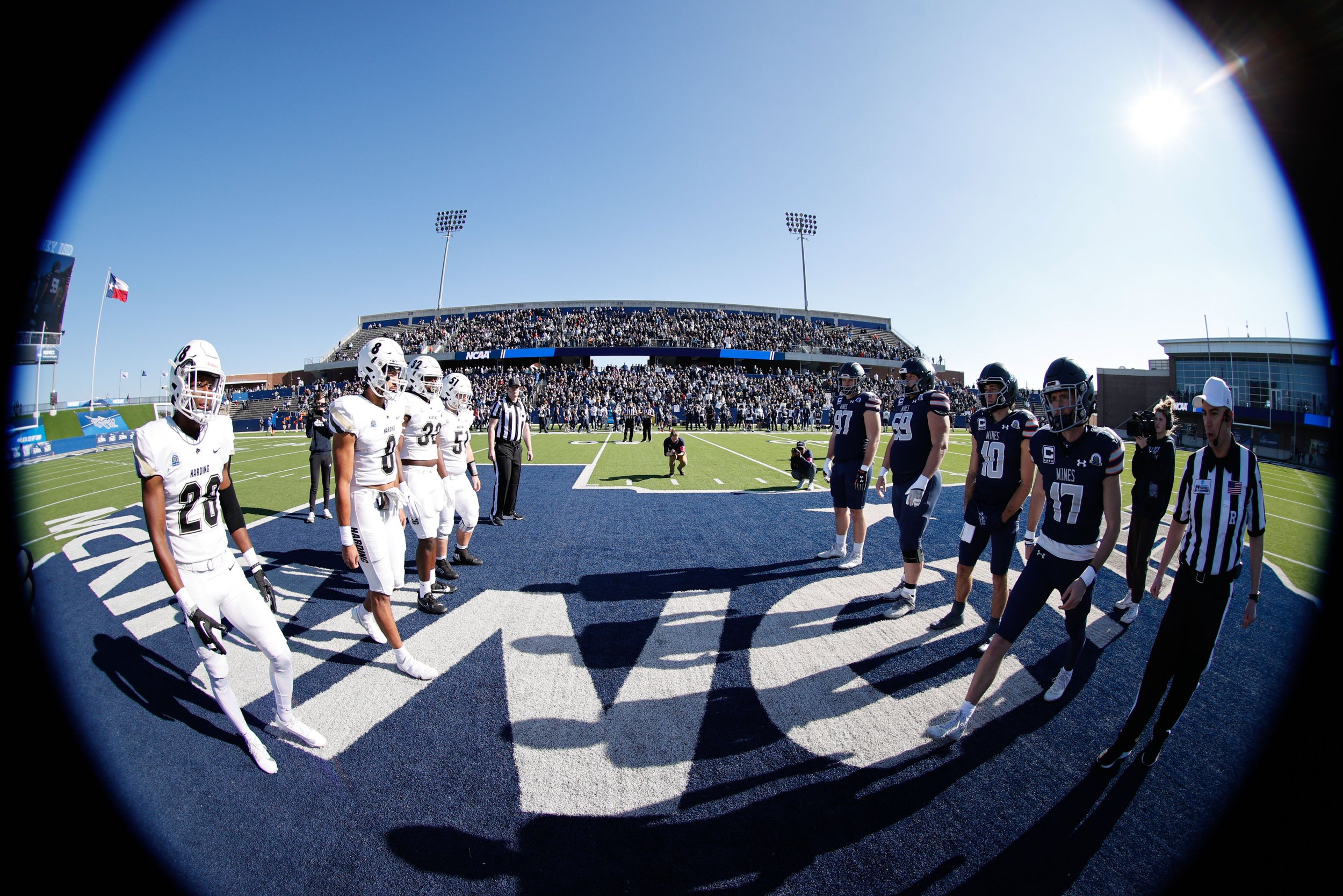  MCKINNEY, TEXAS - DECEMBER 16: EDITORS NOTE: image has been taken with a fisheye lens) The coin toss takes place before the game between the Colorado School of Mines Orediggers and the Harding Bisons during the Division II Football Championship held
