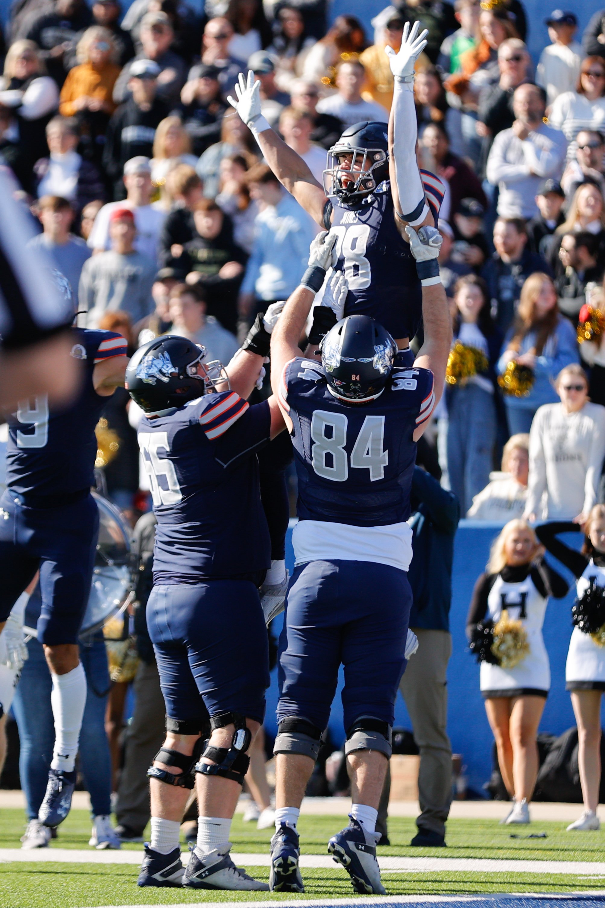  MCKINNEY, TEXAS - DECEMBER 16: Noah Roper #28 of Colorado School of Mines Orediggers celebrates a touchdown with teammates against the Harding Bisons during the Division II Football Championship held at McKinney ISD Stadium on December 16, 2023 in M