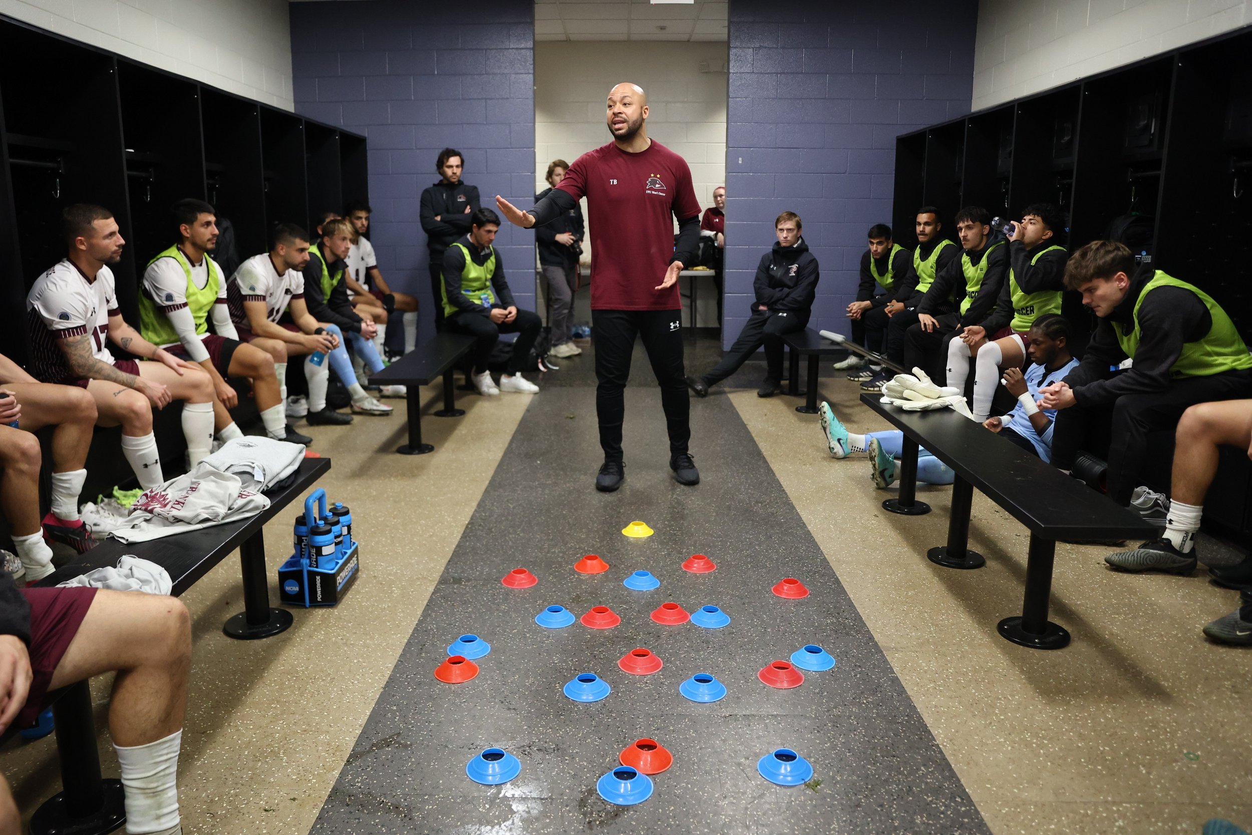  MATTHEWS, NORTH CAROLINA - DECEMBER 9: Head Coach Travis Brent of the Franklin Pierce Ravens talks to the team in the locker room during halftime of the Division II Men's Soccer Championship game against the CSU Pueblo Thunderwolves held at Sportspl