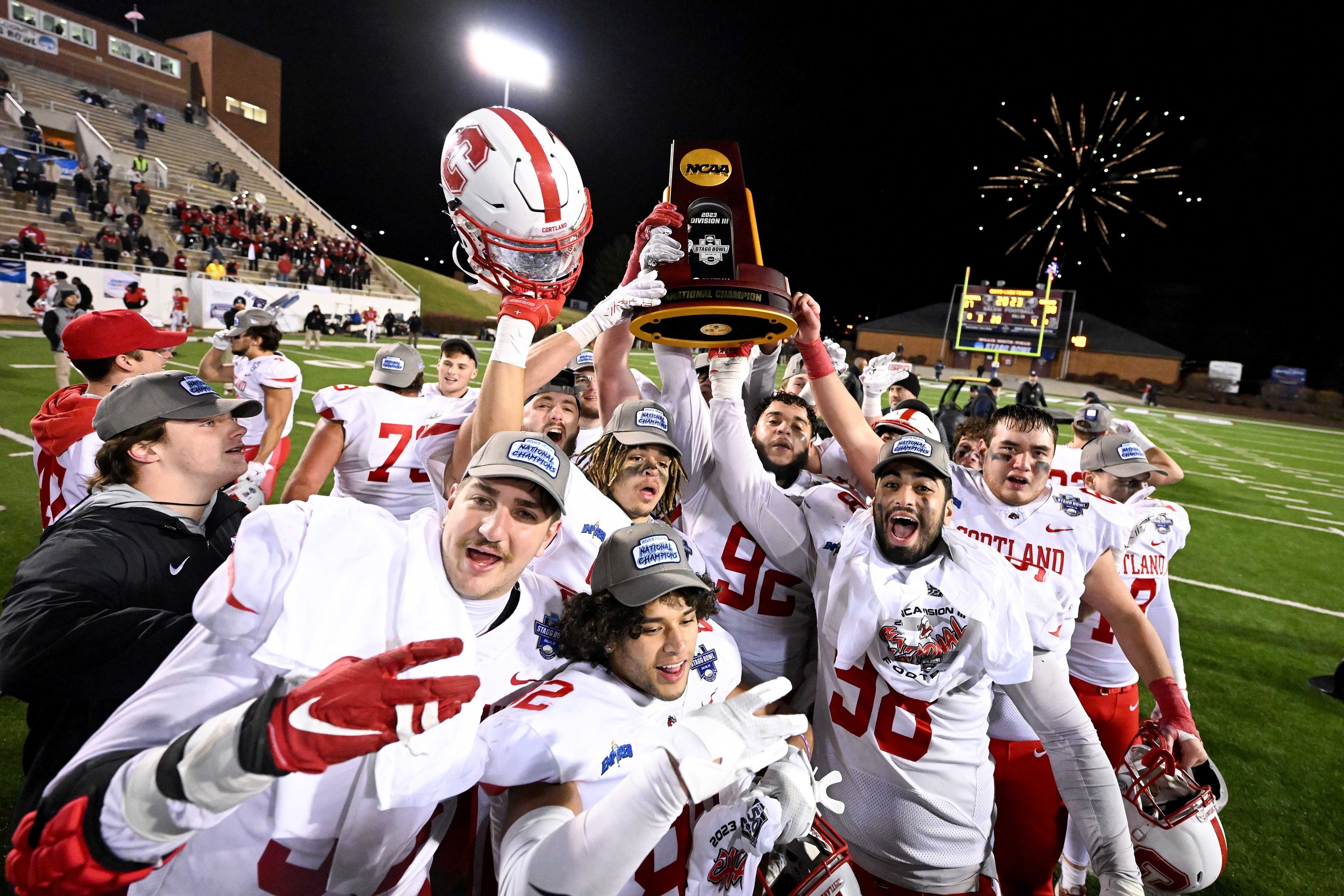  SALEM, VIRGINIA - DECEMBER 15:  The Cortland Red Dragons celebrate after a win against the North Central Cardinals during the Division III Football Championship held at Salem Stadium on December 15, 2023 in Salem, Virginia. Cortland won 38-37. (Phot
