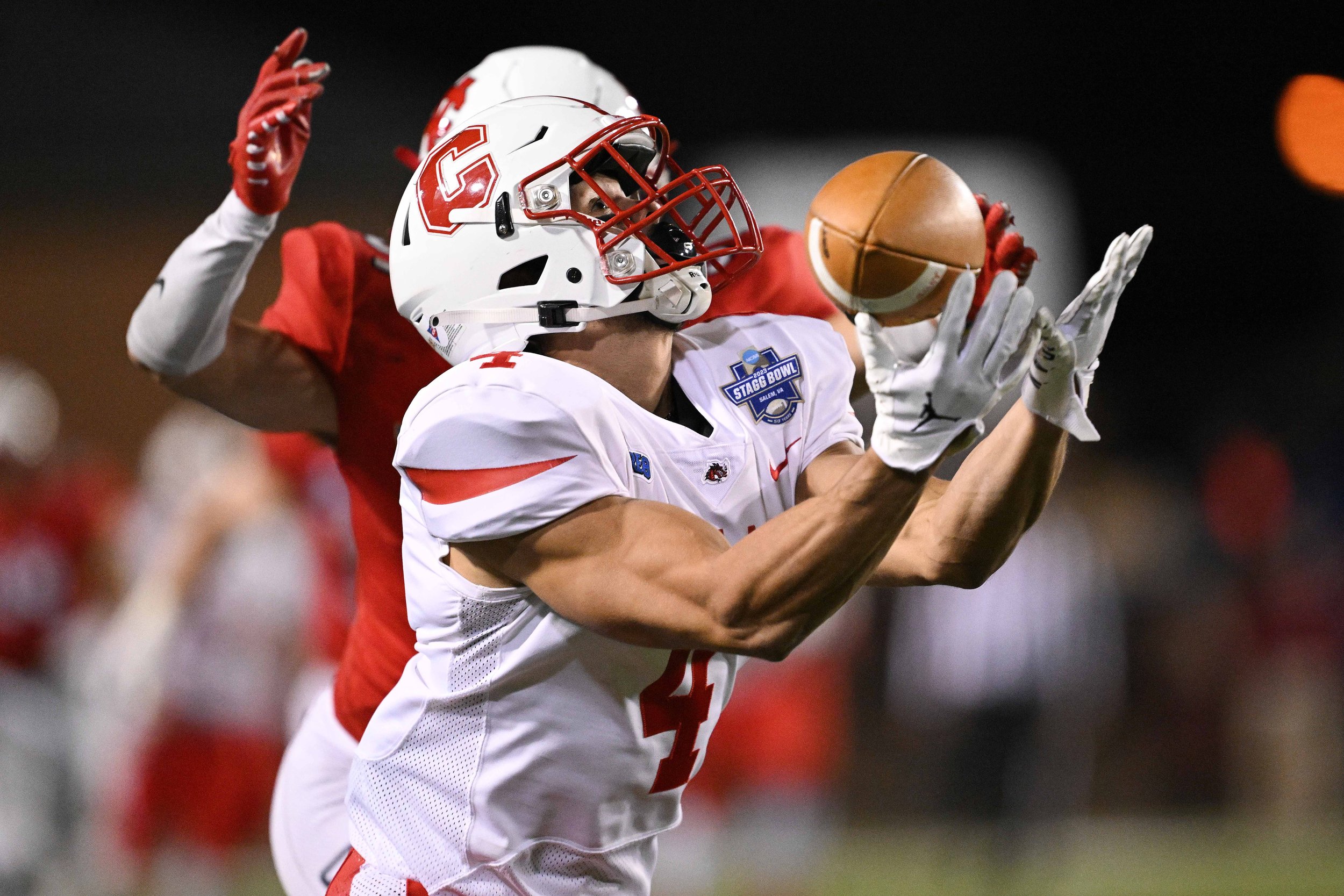 SALEM, VIRGINIA - DECEMBER 15:  Ethan Groark #31 of the North Central Cardinals defends a pass to JJ Laap #4 of the Cortland Red Dragons during the Division III Football Championship held at Salem Stadium on December 15, 2023 in Salem, Virginia. (Ph