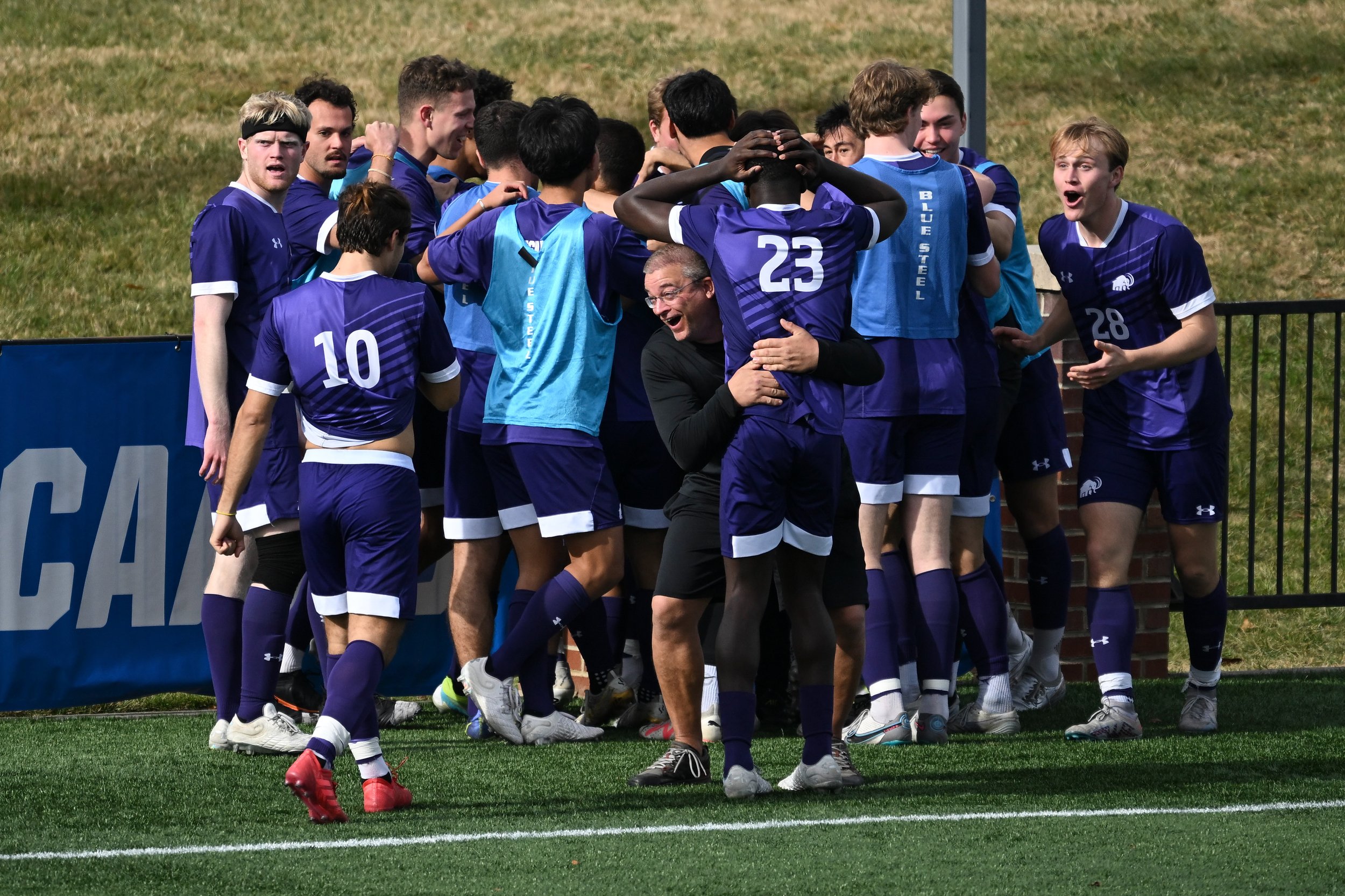  SALEM, VIRGINIA - DECEMBER 03: The Amherst Mammoths celebrate after forward Luka Ohadike #27 of the Amherst Mammoths scores against the St. Olaf Oles during the 2023 Division III Men's Soccer Championship at Donald J. Kerr Stadium on December 03, 20