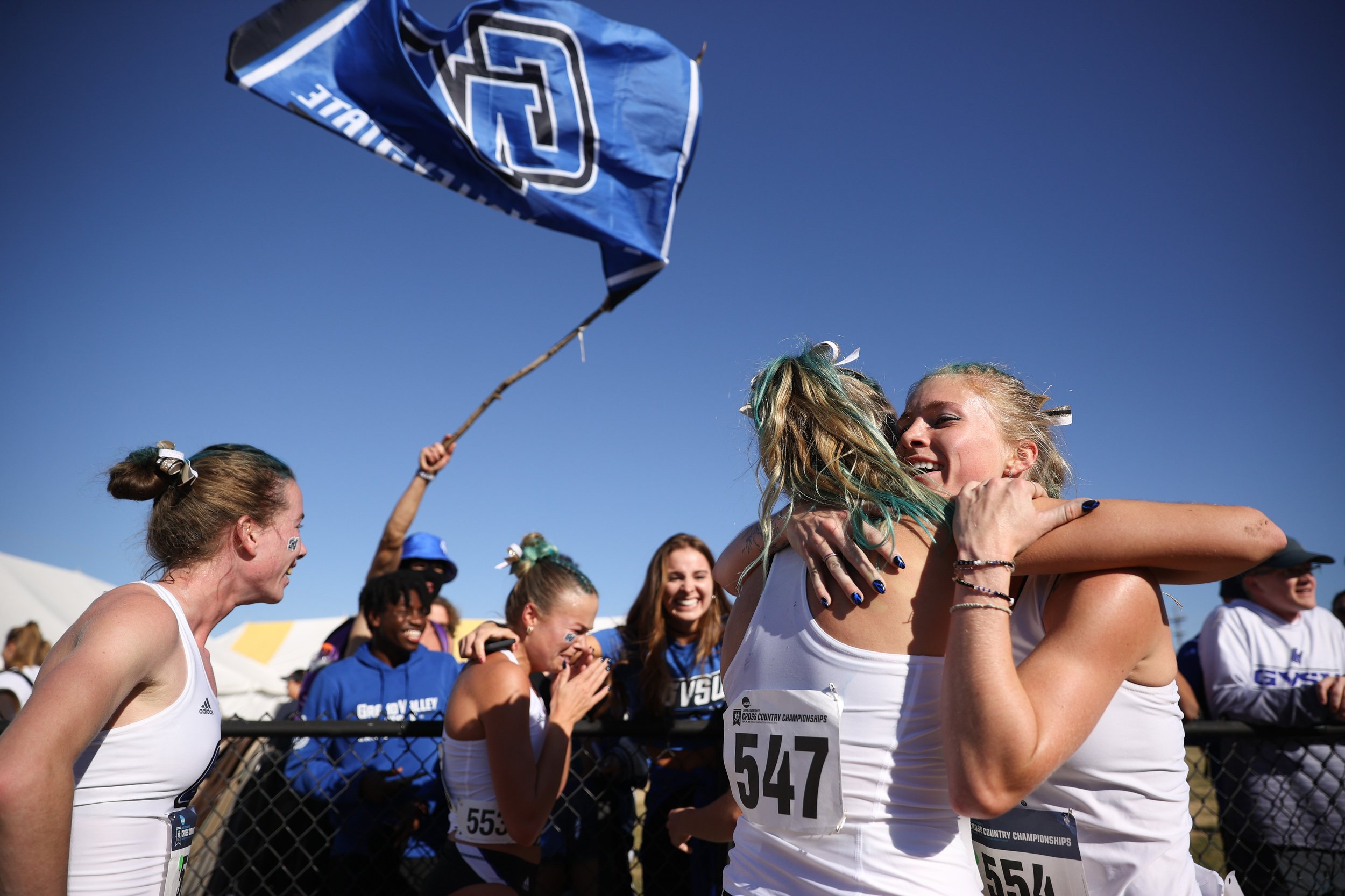  JOPLIN, MISSOURI - NOVEMBER 18: Allie Arnsman and Kayce Rypma of the Grand Valley State Lakers hug after winning the Division II Women's Cross Country Championship held at Tom Rutledge Cross Country Course on November 18, 2023 in Joplin, Missouri. (