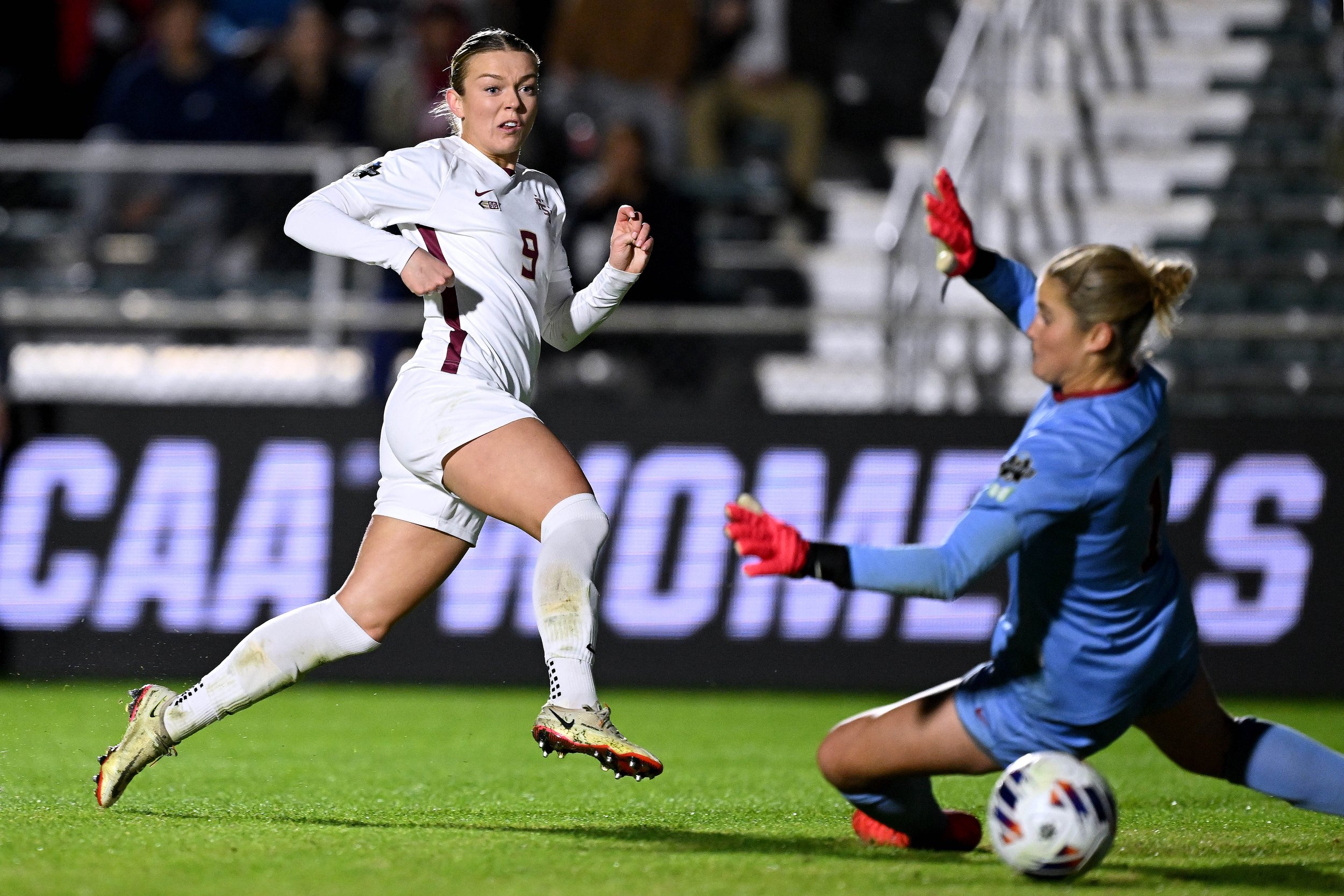  RALEIGH, NORTH CAROLINA - DECEMBER 04:  Beata Olsson #9 of the Florida St. Seminoles scores a goal against Ryan Campbell #1 of the Stanford Cardinal during the 2023 Division I Women's Soccer Championship at Wake Med Soccer Park on December 04, 2023 