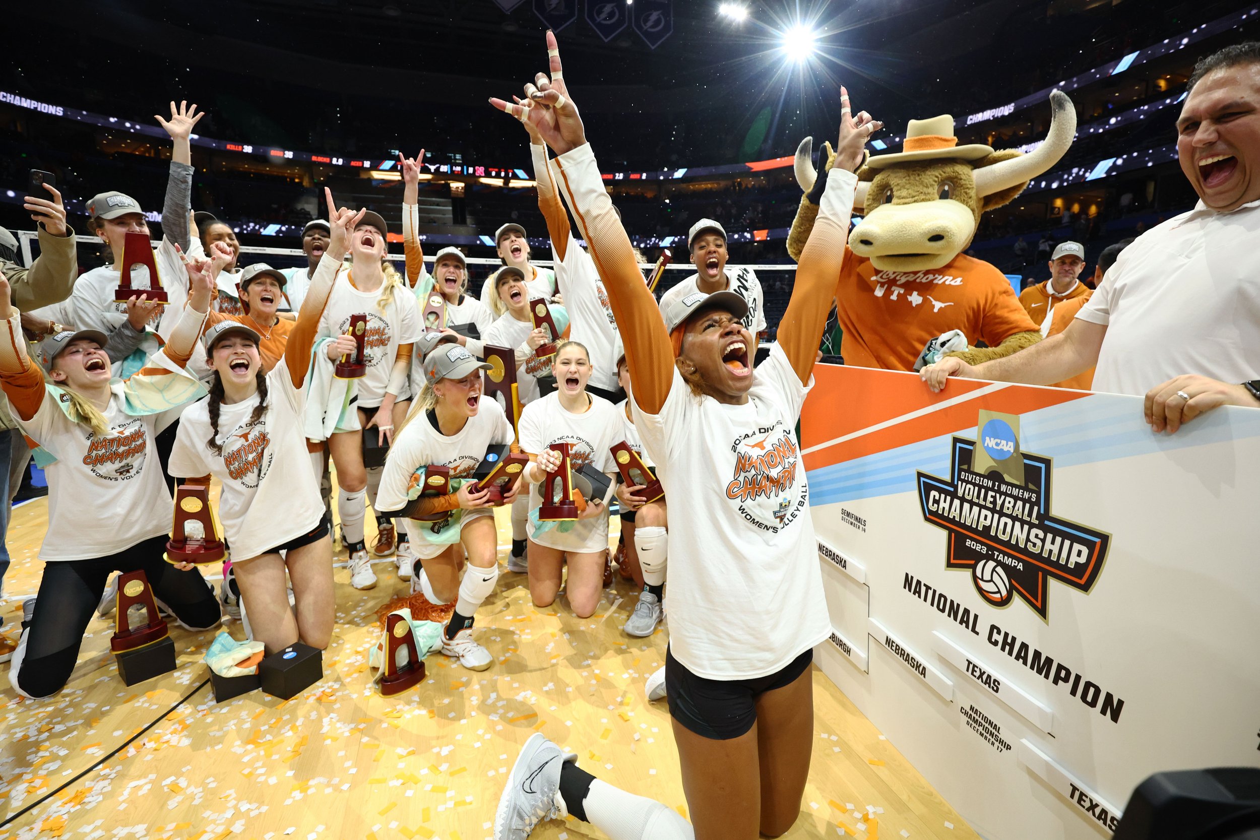  TAMPA, FLORIDA - DECEMBER 17: The Texas Longhorns celebrate after defeating the Nebraska Cornhuskers 3-0 to win the 2023 Division I Women's Volleyball Championship at Amalie Arena on December 17, 2023 in Tampa, Florida. (Photo by Jamie Schwaberow/NC