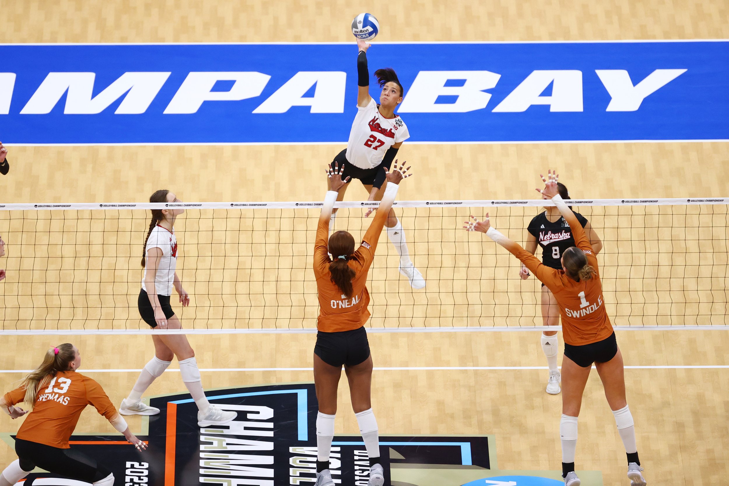  TAMPA, FLORIDA - DECEMBER 17: Harper Murray #27 of the Nebraska Cornhuskers spikes the ball against the Texas Longhorns during the 2023 Division I Women's Volleyball Championship at Amalie Arena on December 17, 2023 in Tampa, Florida. (Photo by Jami