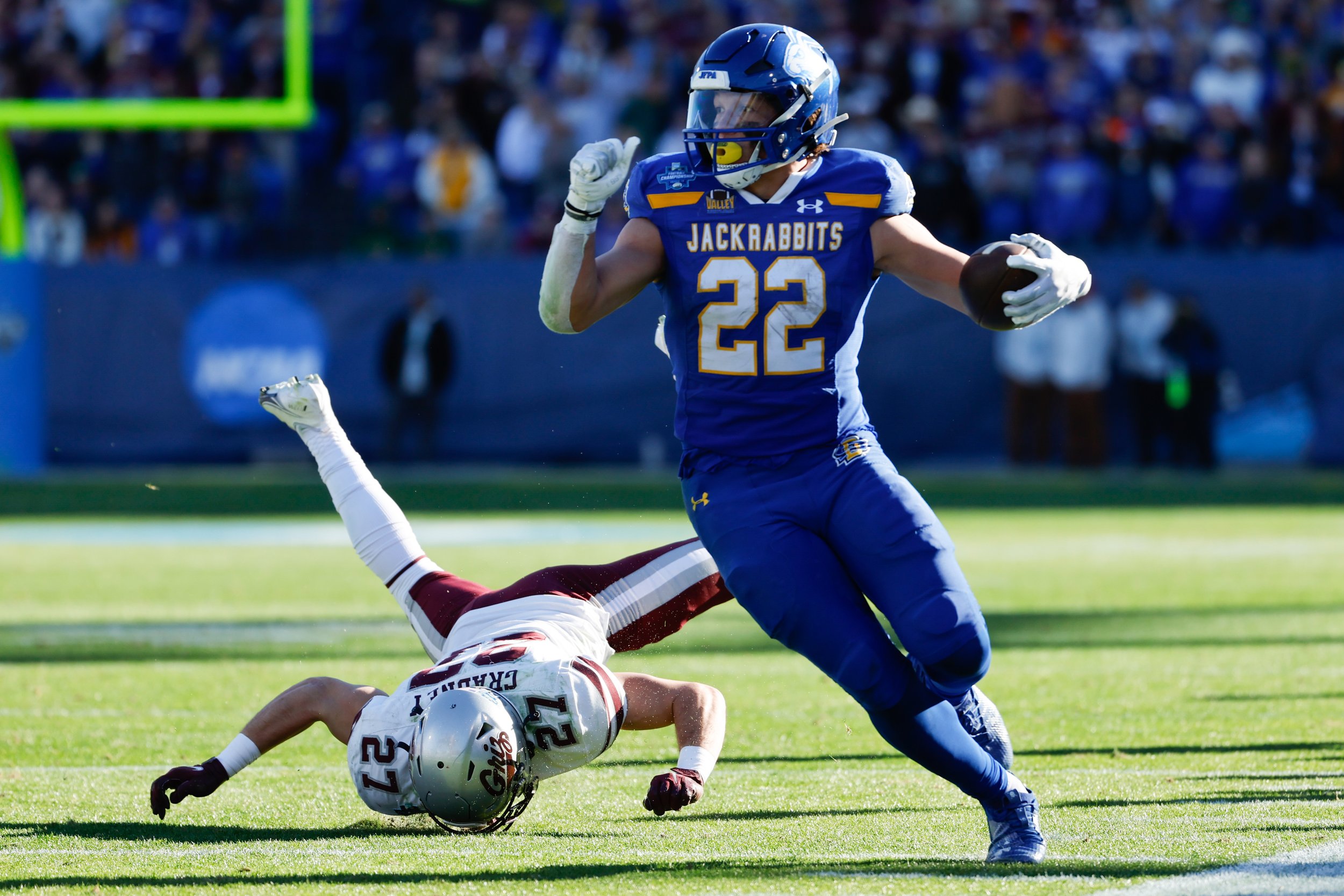  FRISCO, TEXAS - JANUARY 7: Isaiah Davis #22 of the South Dakota State Jackrabbits rushes against the Montana Grizzlies during the Division I FCS Football Championship held at Toyota Stadium on January 7, 2024 in Frisco, Texas. (Photo by C. Morgan En