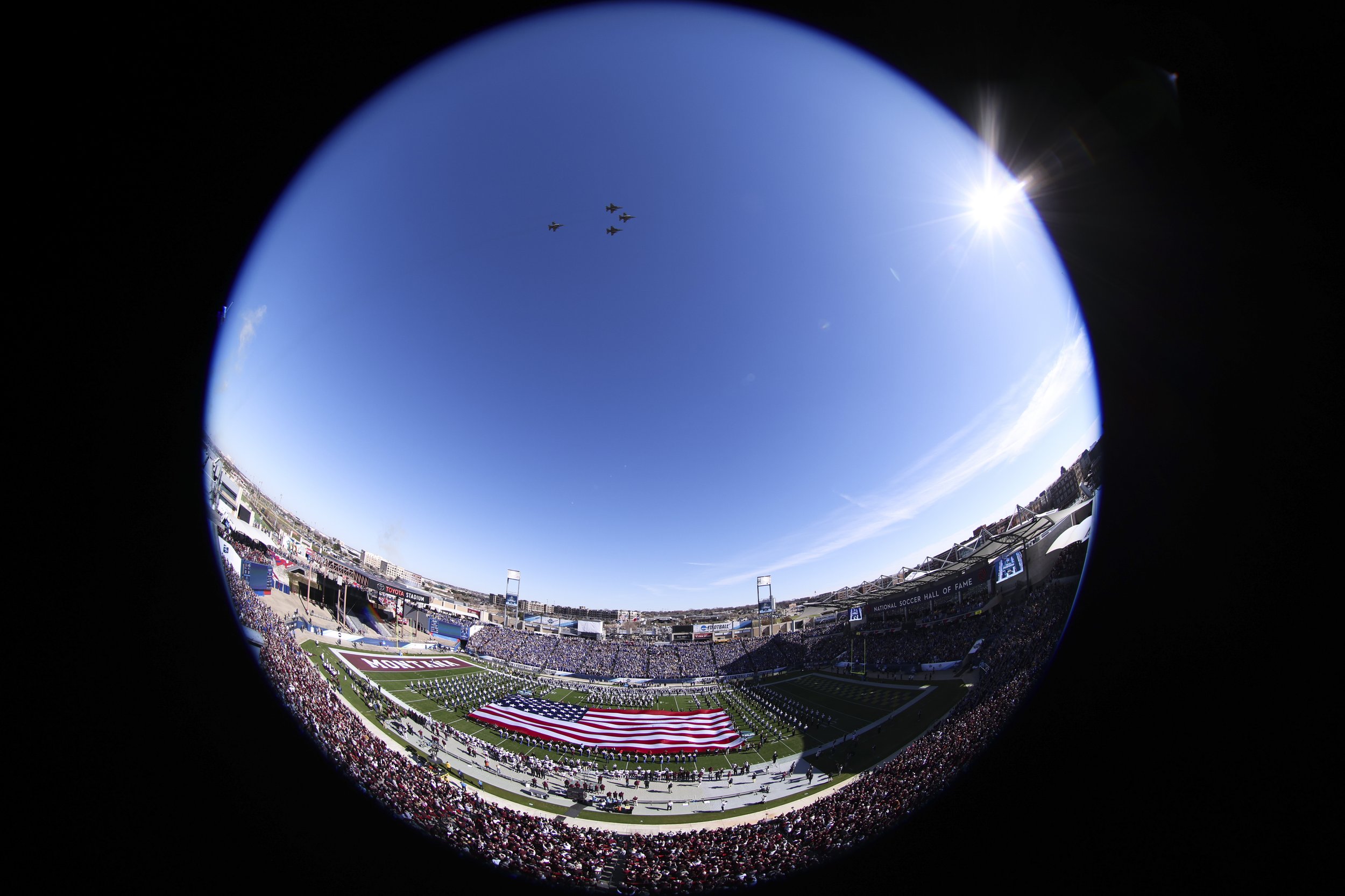  FRISCO, TEXAS - JANUARY 7: (EDITORS NOTE: image has been taken with a fisheye lens) A flyover takes place during the national anthem before the Division I FCS Football Championship game between the South Dakota State Jackrabbits and the Montana Griz