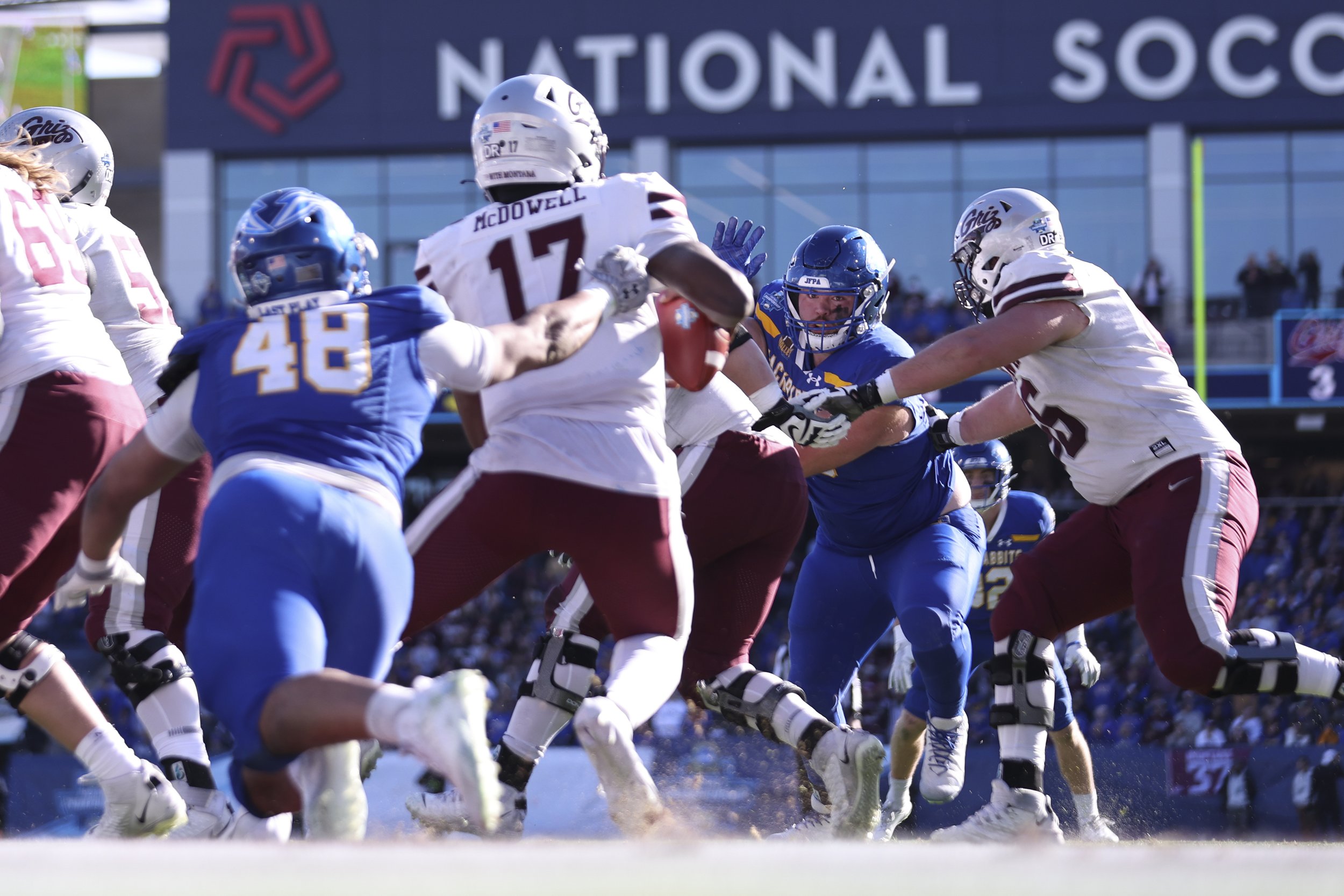  FRISCO, TEXAS - JANUARY 7: Aaron Wolfcale-Holsten #55 of the South Dakota State Jackrabbits battles against the Montana Grizzlies defense during the second half of the Division I FCS Football Championship held at Toyota Stadium on January 7, 2024 in