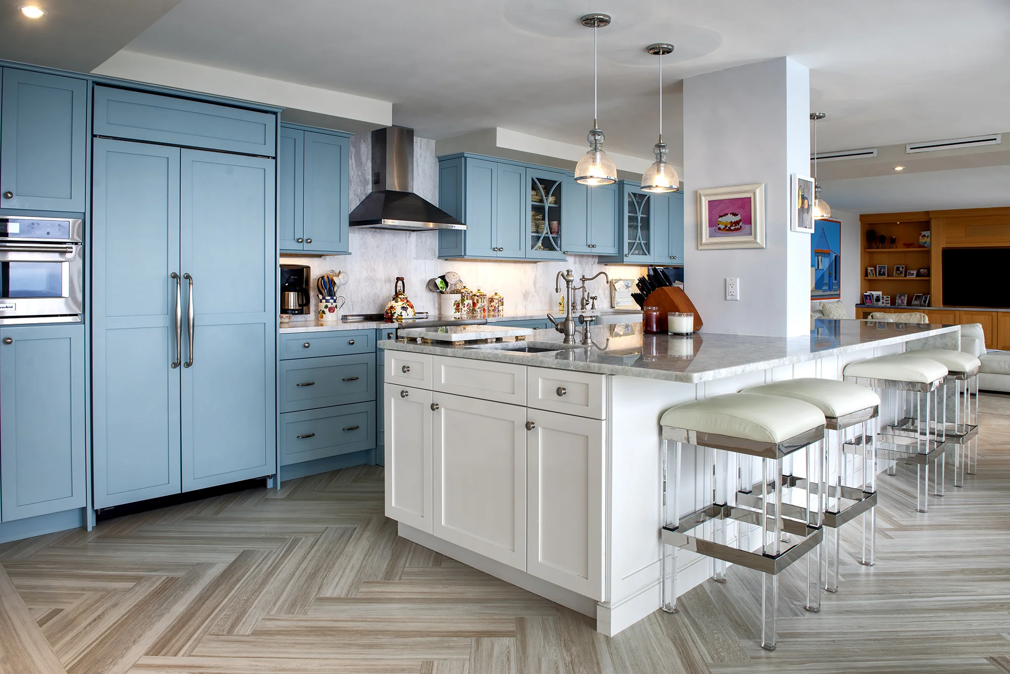 Wood-Mode Oceanside blue cabinets with the herringbone pattern plank flooring tile.