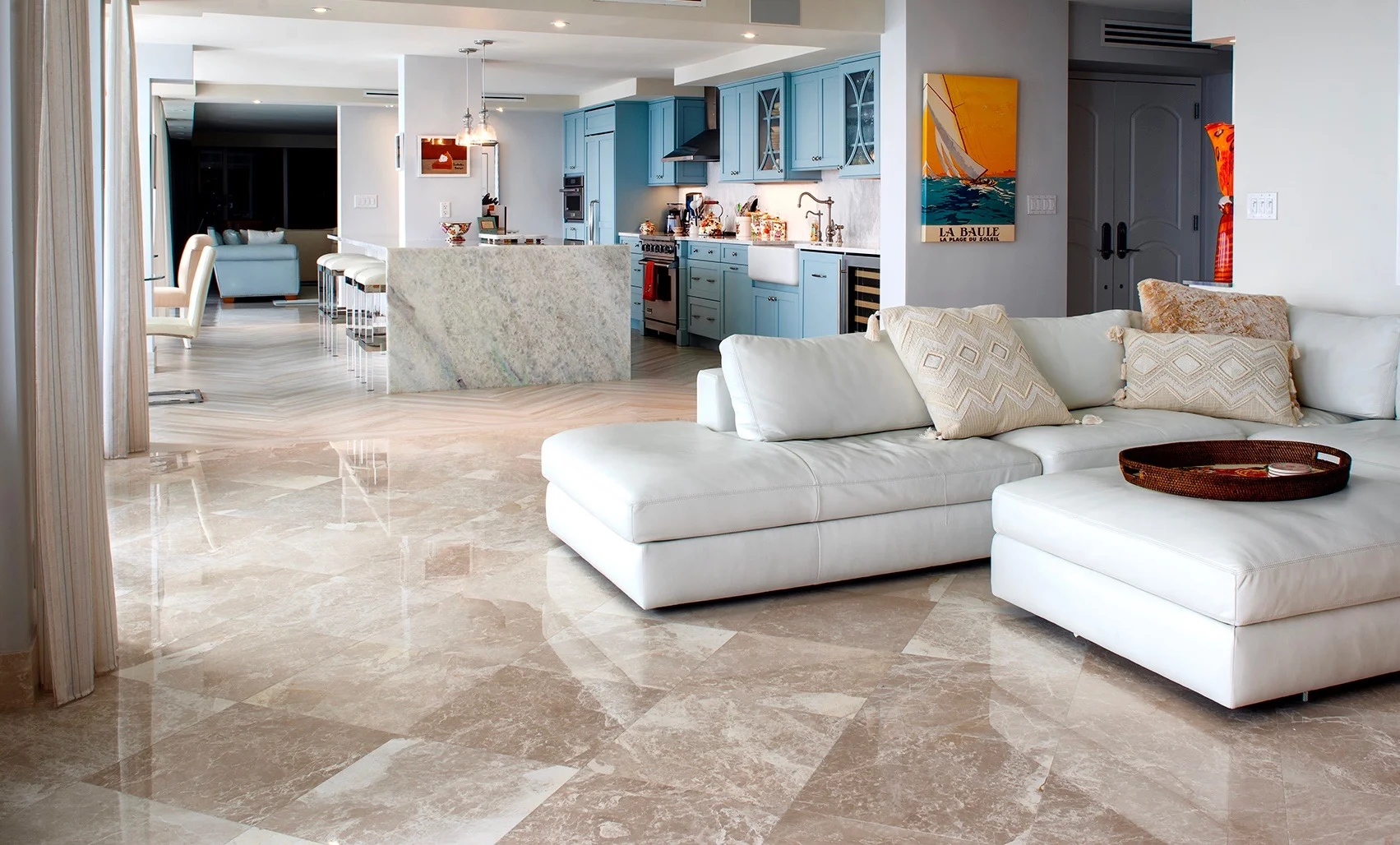 Family_Room_View_Kitchen_blue_cabinets_tile_flooring.jpg
