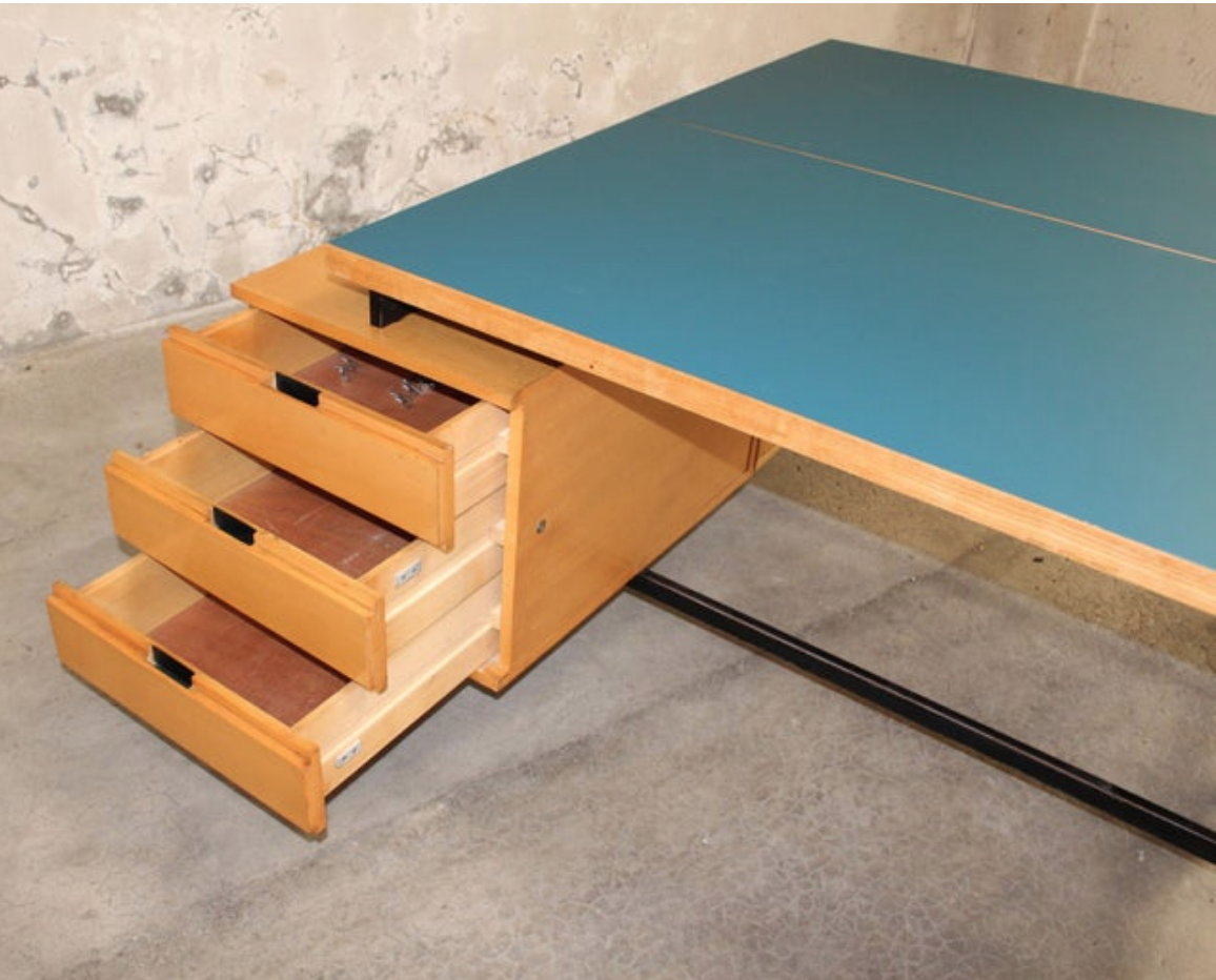 Close up view of desk drawers and Formica tabletop.
