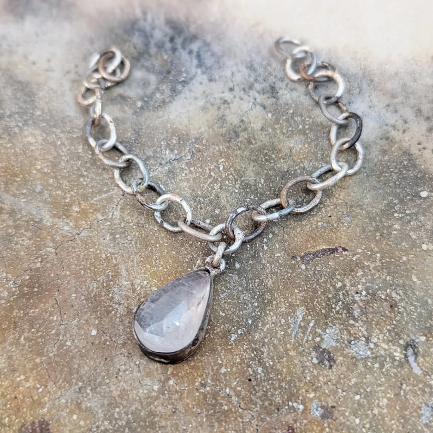 A work in progress. A handmade chain, each link slowly crafted and soldered together to suspend this beautiful pale pink Morganite. I'm around half way through making this chain, I'm excited already to get it polished up and the stone set! Made using