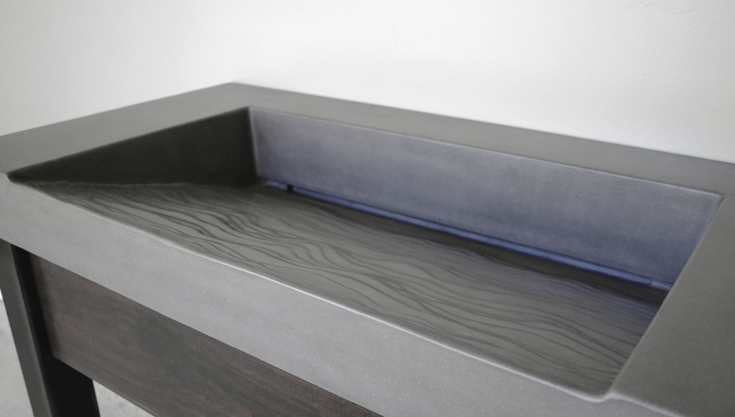 Topo Textured Concrete Ramp Sink.jpg