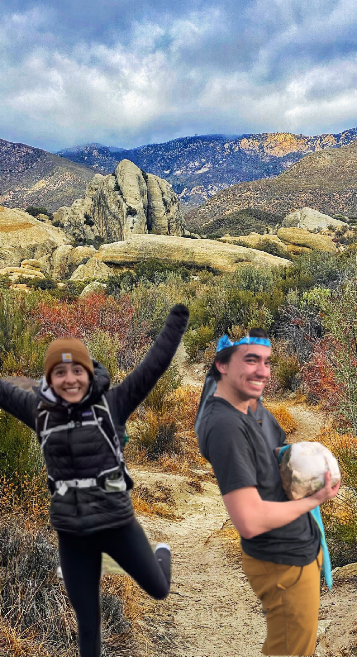 two awesome guides in front of a cool rock