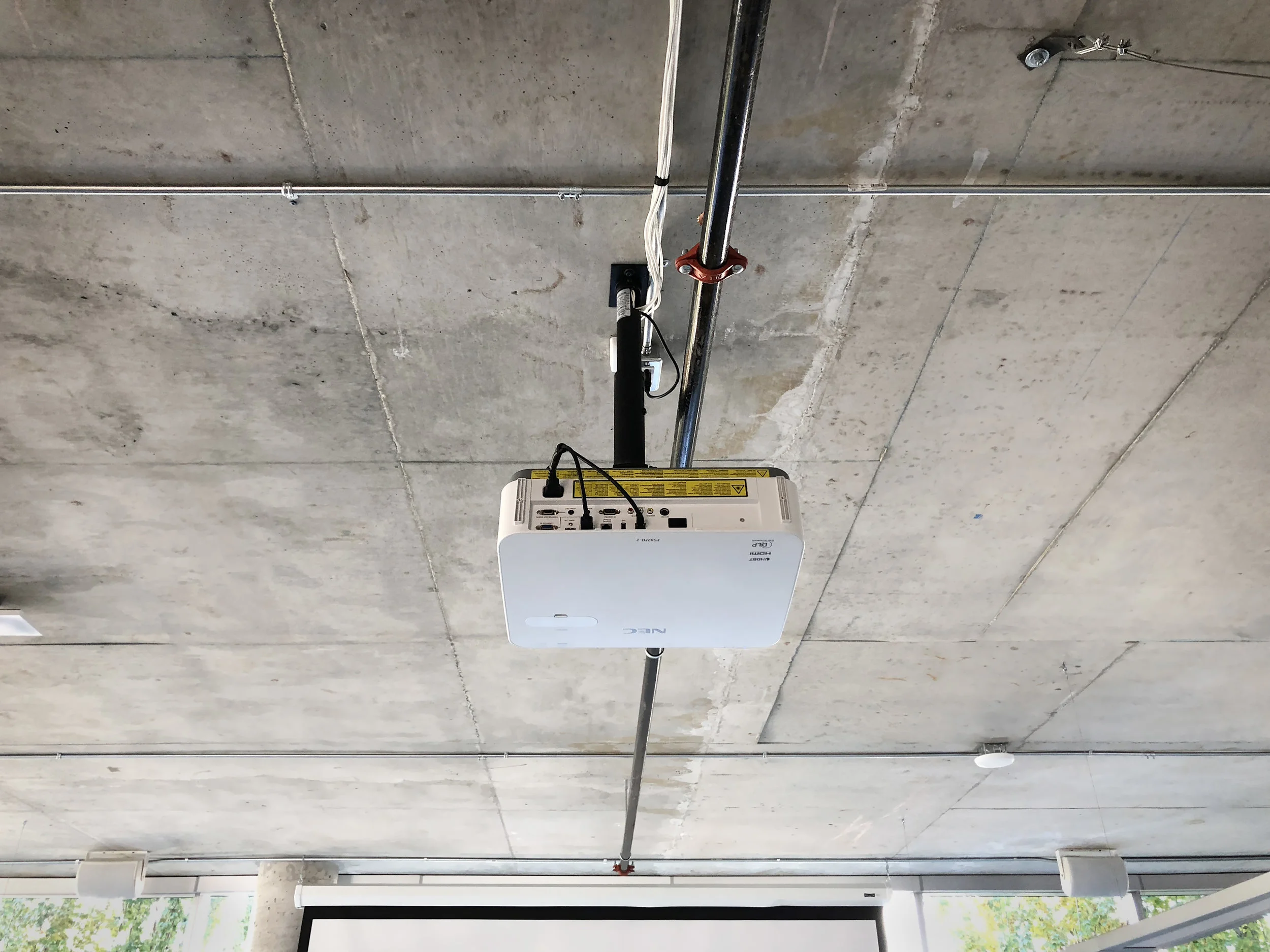 Clean and simple, surface run cable looms serve the devices throughout the temporary space.