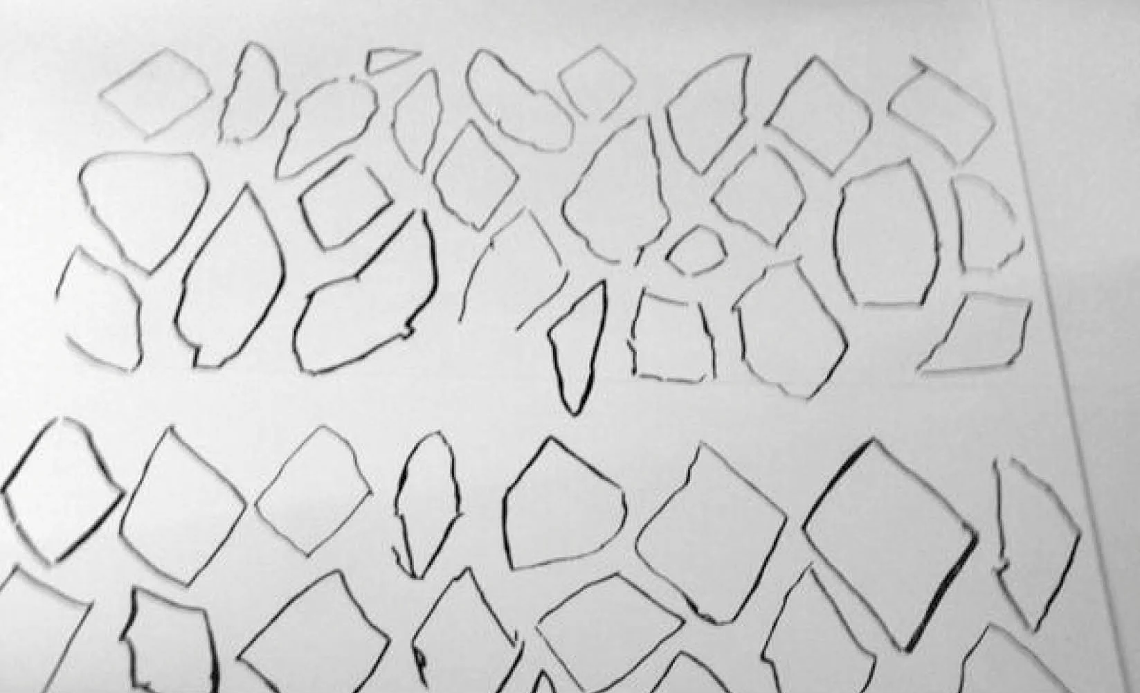 Image taken by the artists at the Ellis Island Museum of Immigration. The diamonds were drawn by immigrants as part of a cognitive test that required them to copy geometric shapes. The ones at the top were drawn by immigrants who had never held a pencil before, the middle ones by immigrants who had never gone to school, and the bottom group by those who had completed less than a year of schooling.