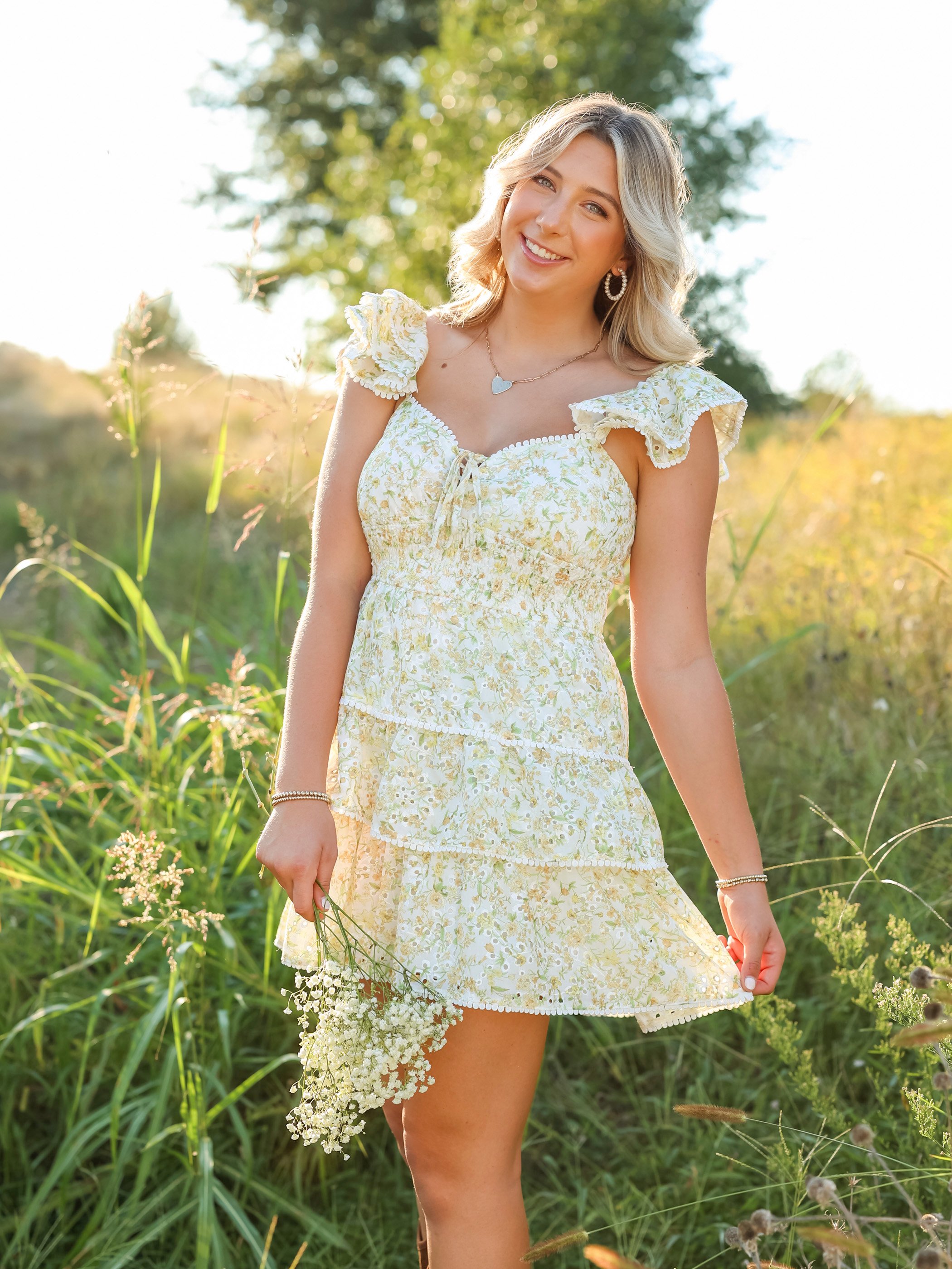 High school senior girl smiling during golden hour senior portrait session in Raleigh, NC