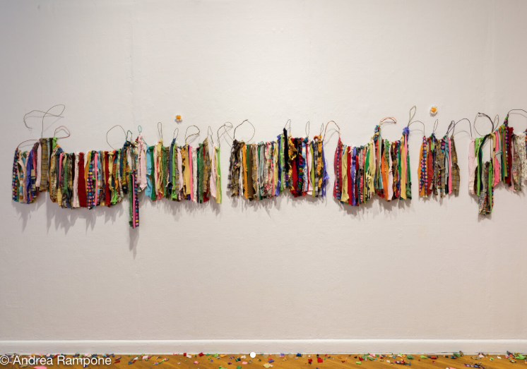 Daniela Cavazos Madrigal, I want you a joke (Te quiero un chingo) , Wire hangers, discarded clothing (Ganchos de alambra, ropa usada), 14” x 144,” 2017