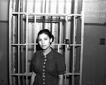 Emma Tenayuca standing inside jail, June, 1937. Photographed in San Antonio, Texas. Courtesy of the Institute of Texan Cultures