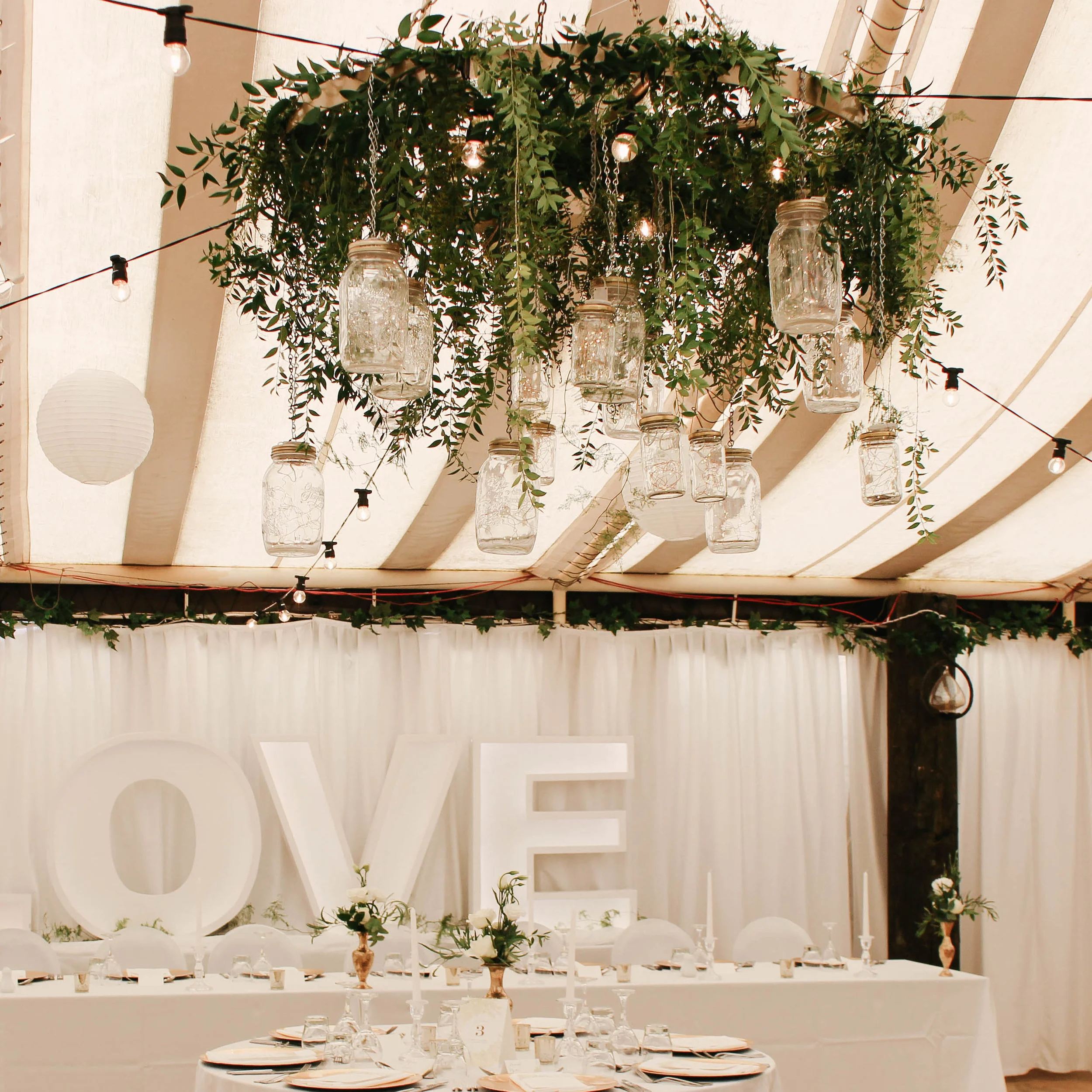 Wagon wheel chandelier floral.jpg