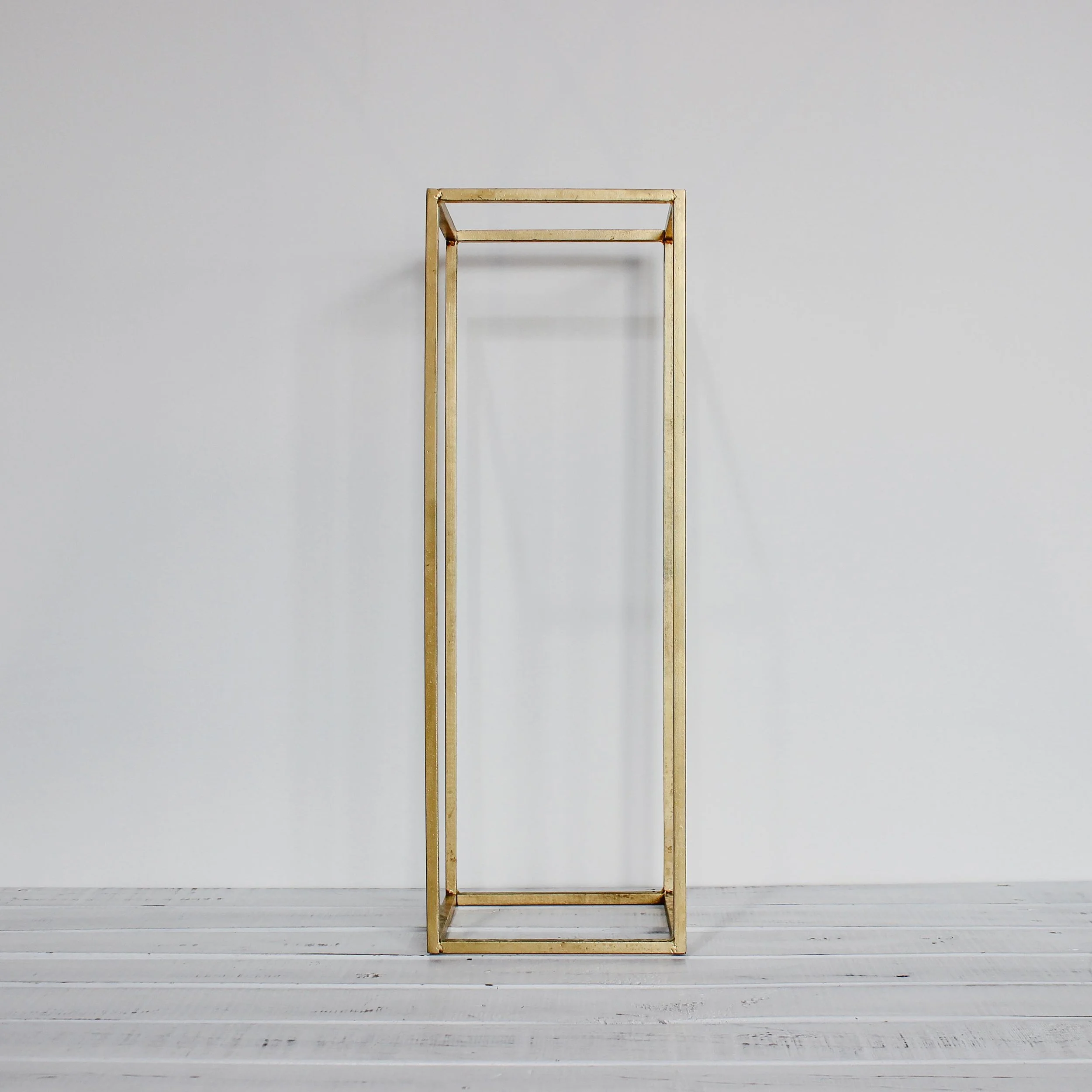 Gold pillar frame stand.jpg