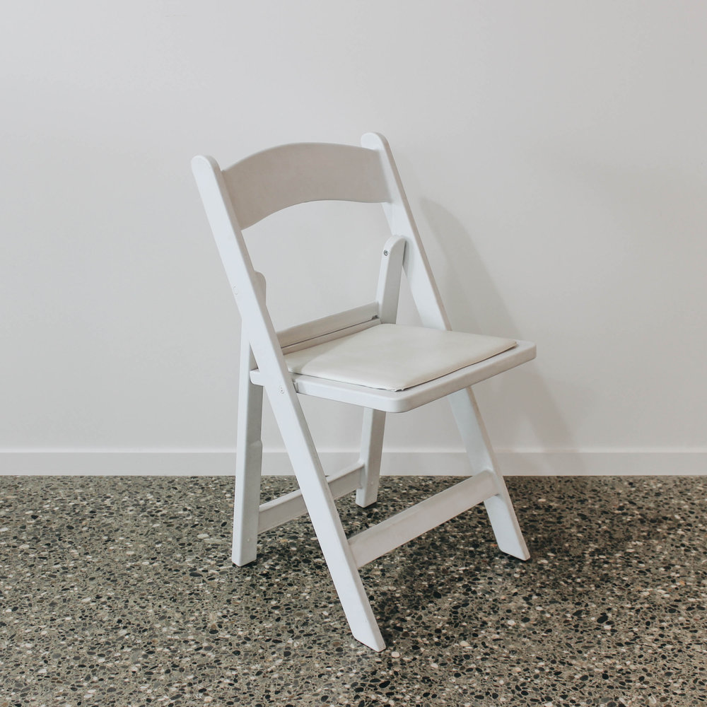 White resin folding chair.jpg