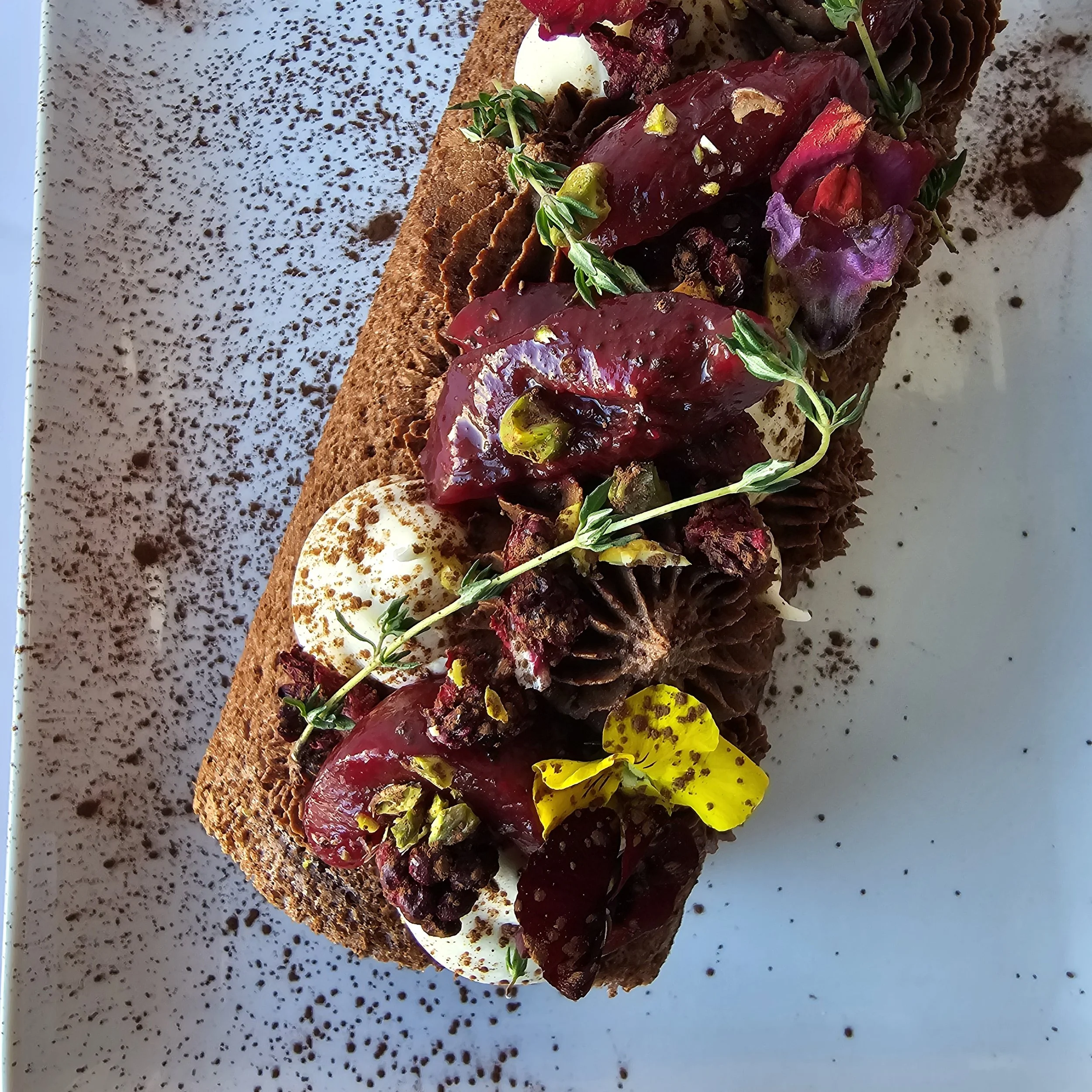 Black Doris plum and chocolate Swiss roll with whipped chocolate ganache