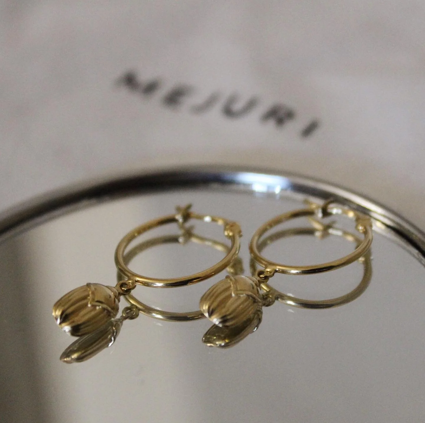Meet The Menagerie, the newest collection from @mejuri ~ This edition is showcasing three symbols of protection - creativity &amp; rebirth to attract prosperity. These gold vermeil Scarab earrings attract good luck and energy✨Thank you #mejuri @mejur