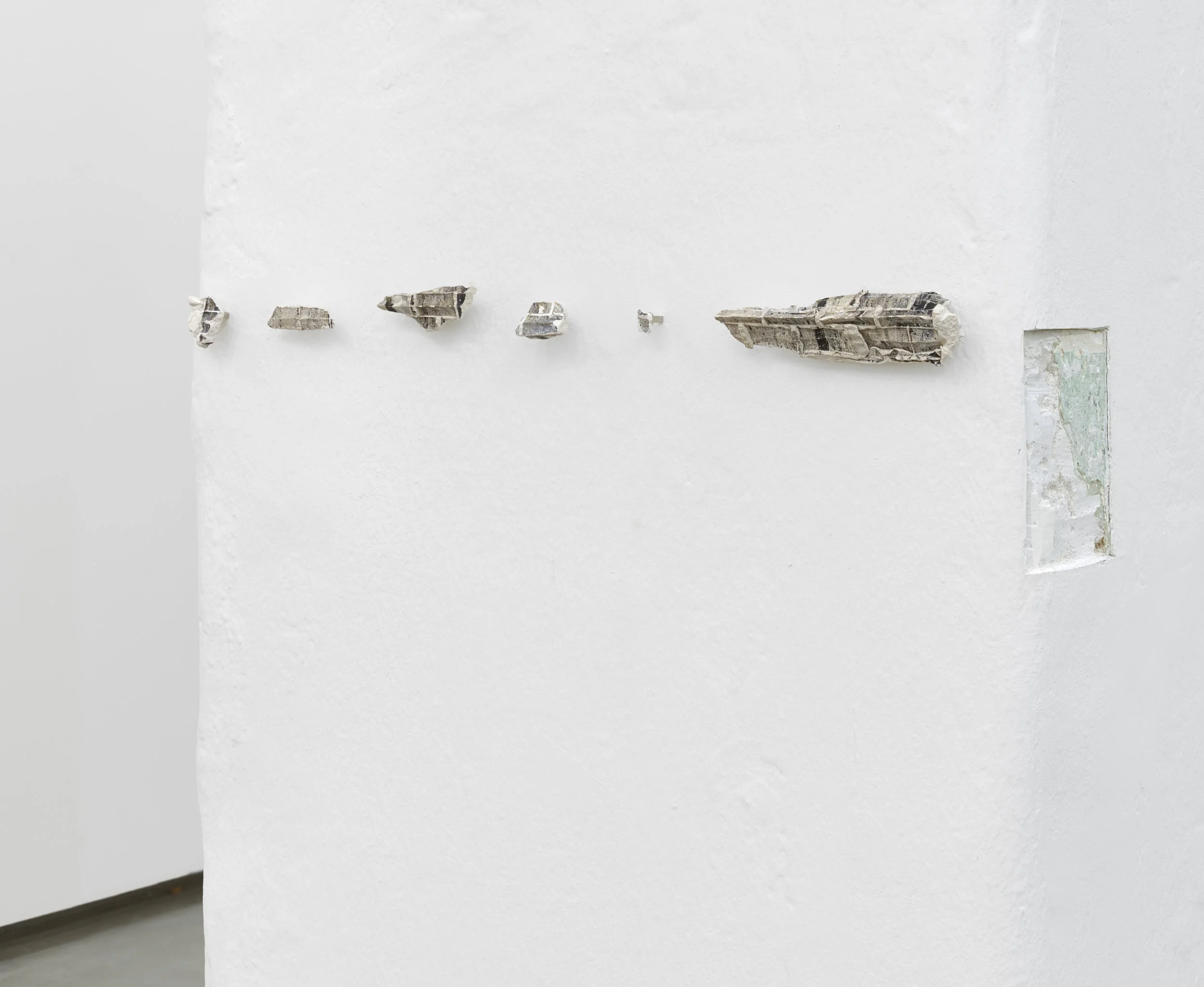 Patterns of a drifting list, 2016 carved wall, plaster and transferred photo dimensions variable
