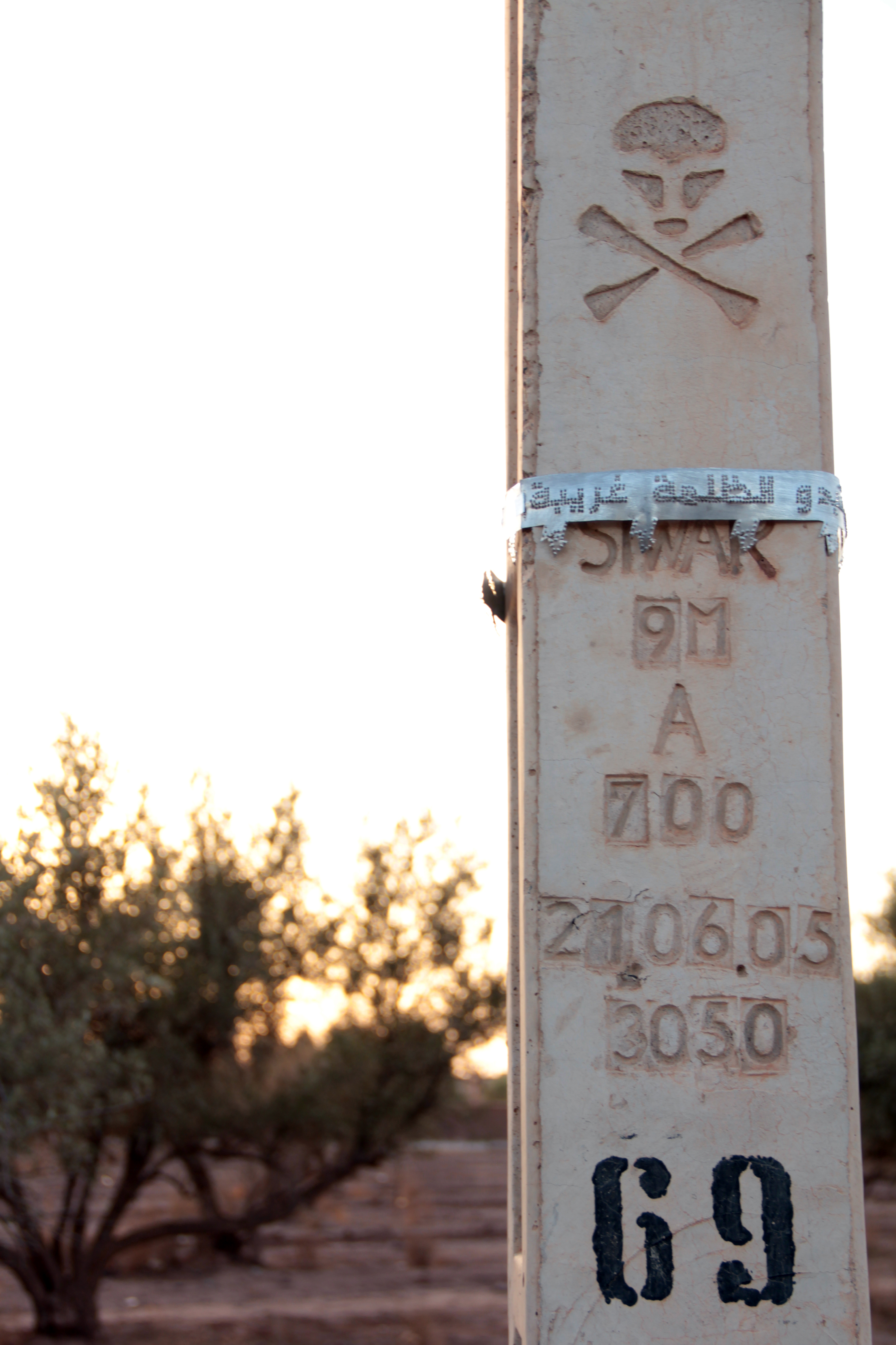    when the lights go out darkness seems strange  , 2012   hammered aluminum on concrete electricity poles   Ourika Valley, Marrakech   From  Where were you when the lights went out?  