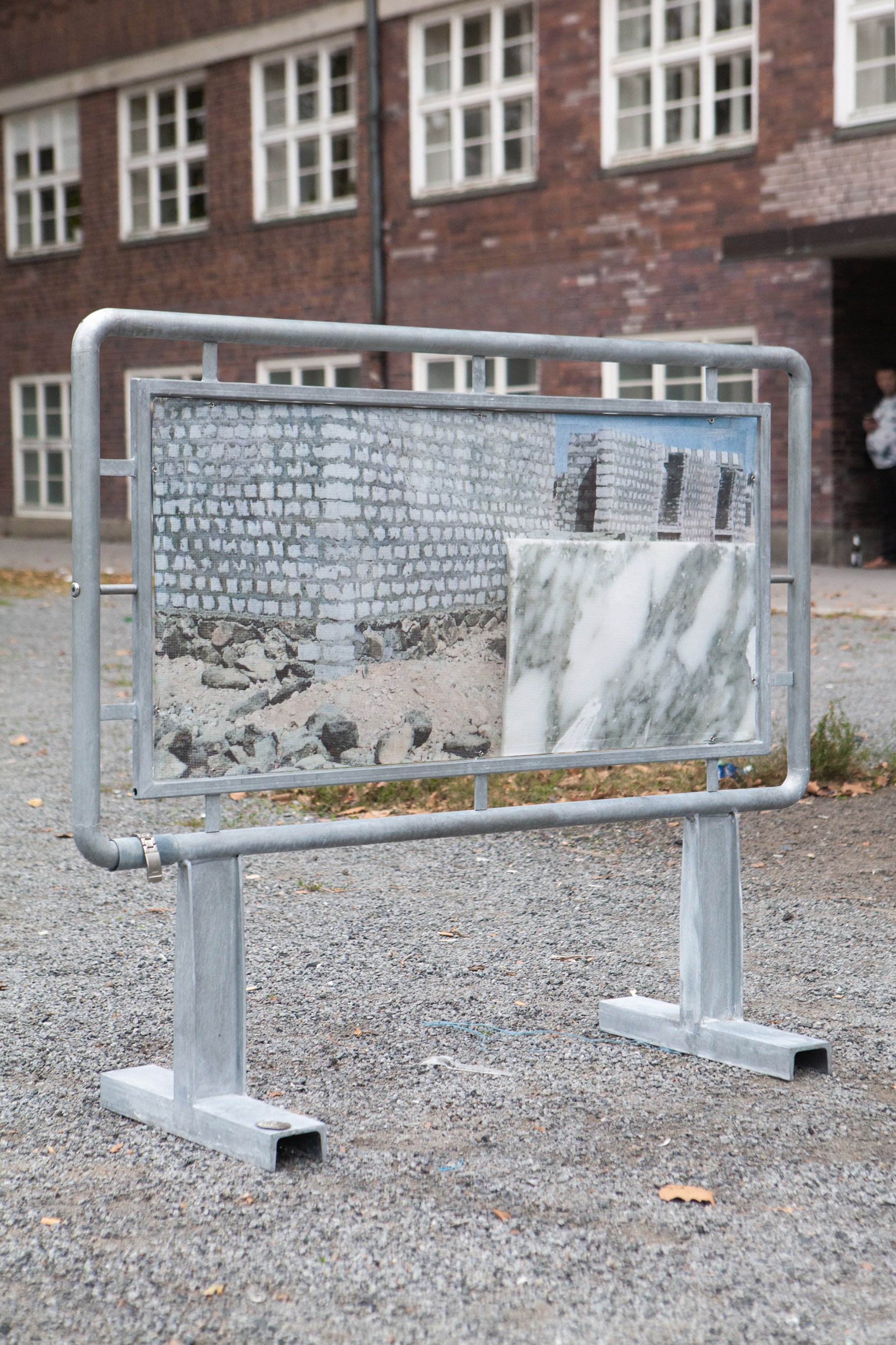    Raising minimum defenses (prelude)  , 2021  zinc coated steel,  print on mesh banner, eyelets, steel wire, bleached velvet paper,  metal watch band, and stamped tin  120 x 105 x 40 cm 