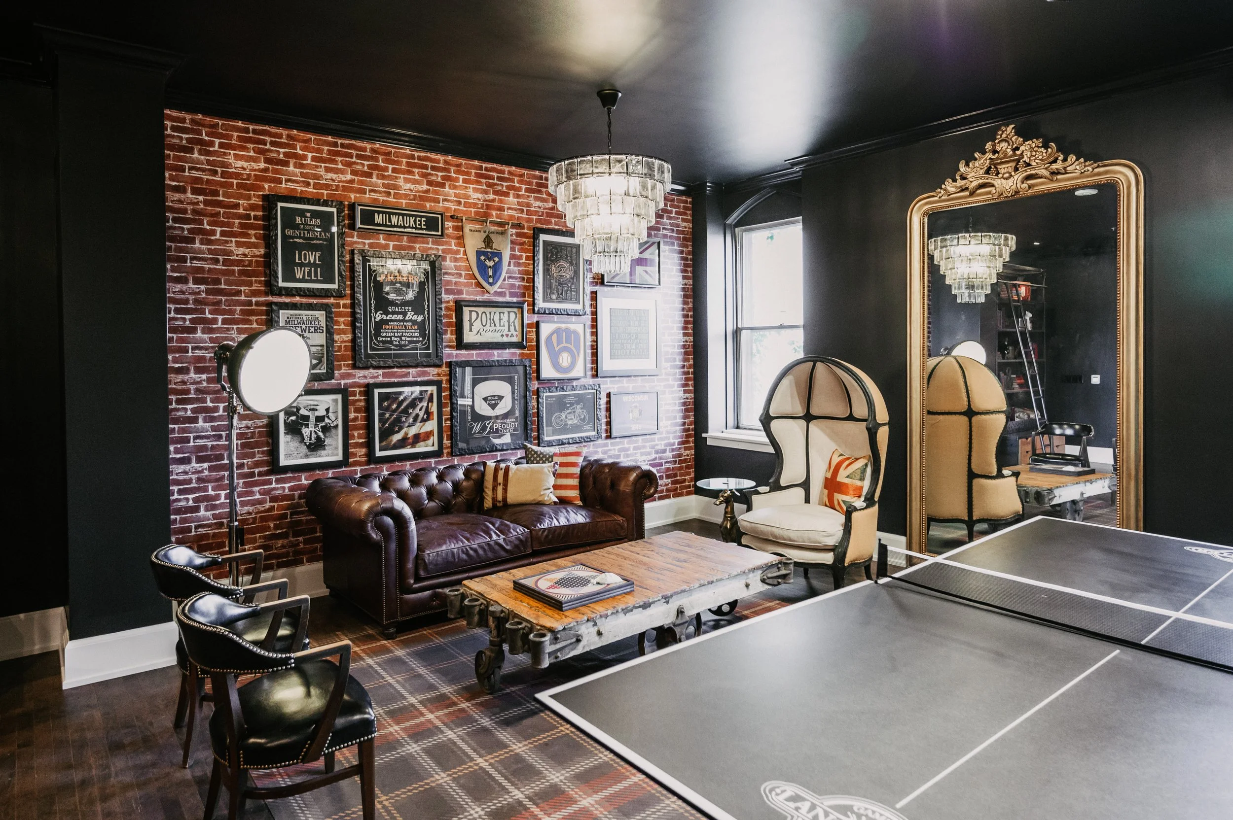 Duke Suite getting ready space at St. James 1868 with lounge seating and a ping pong table.