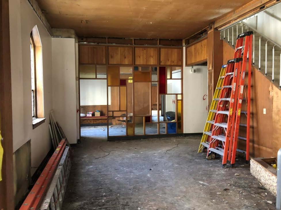 The Hyde lounge space before renovation with blank walls