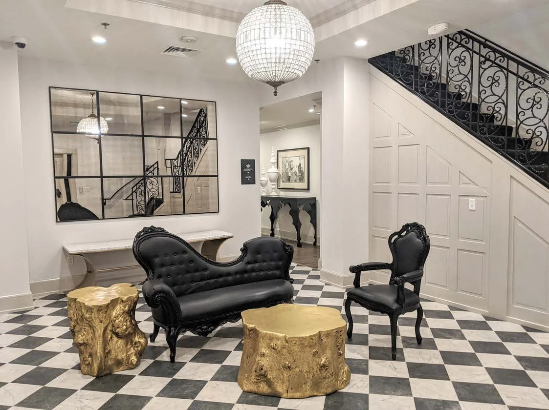 The Hyde lobby with lounge seating and a detailed feature wall