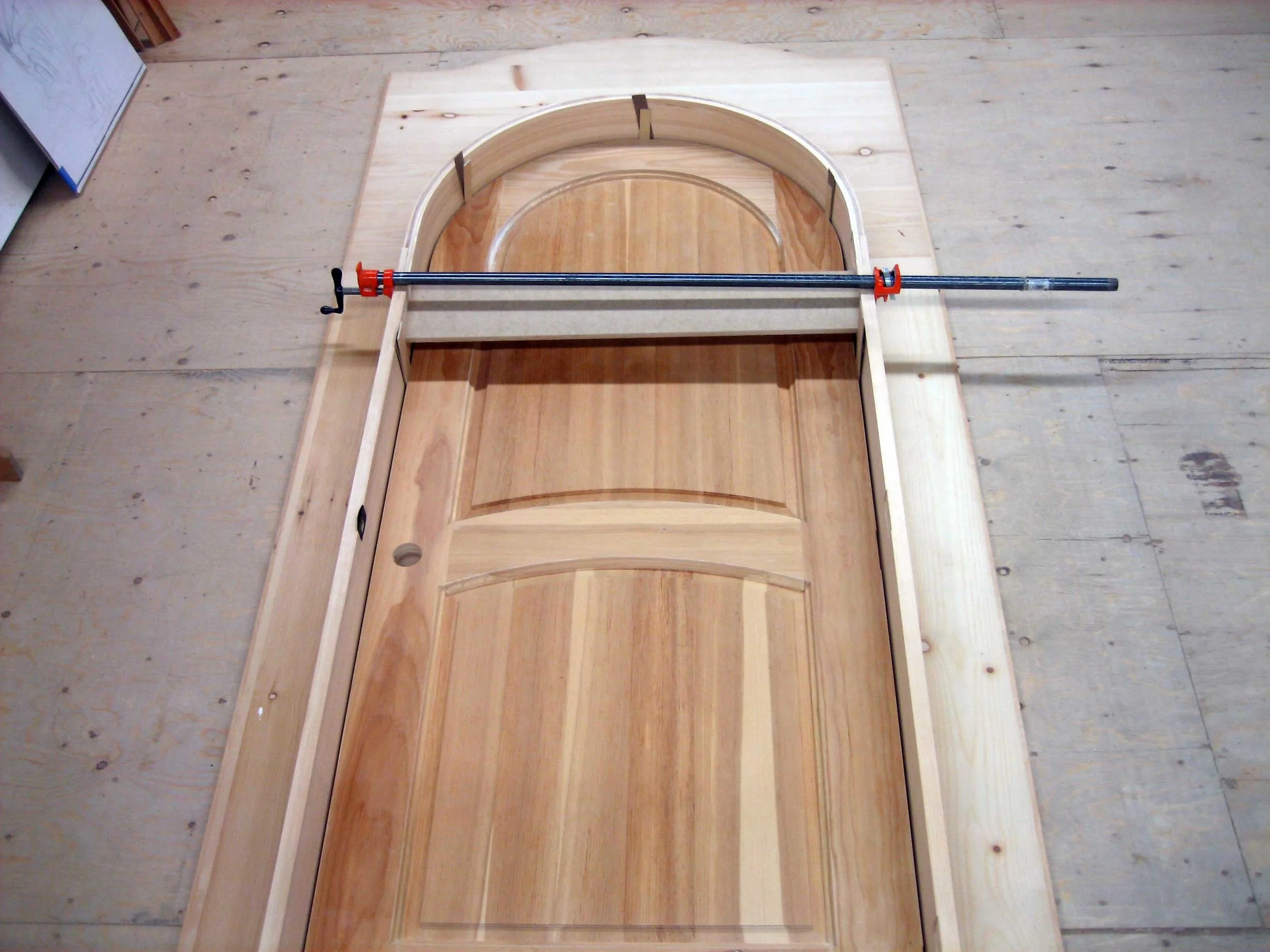 28 – Laying out the door and carvings on the pine backer board.