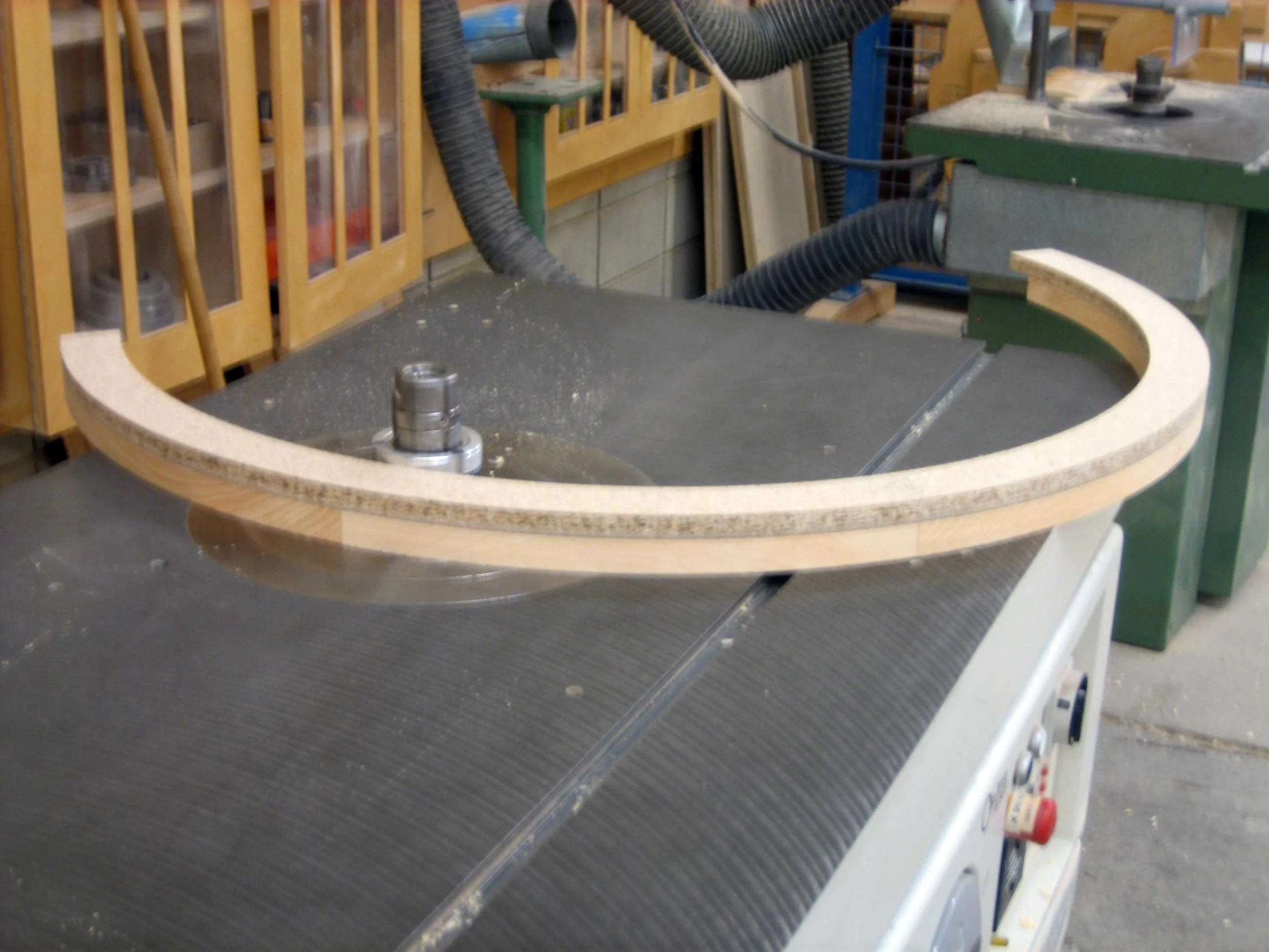 33 – Trimming to size using a particle board pattern on the shaper.