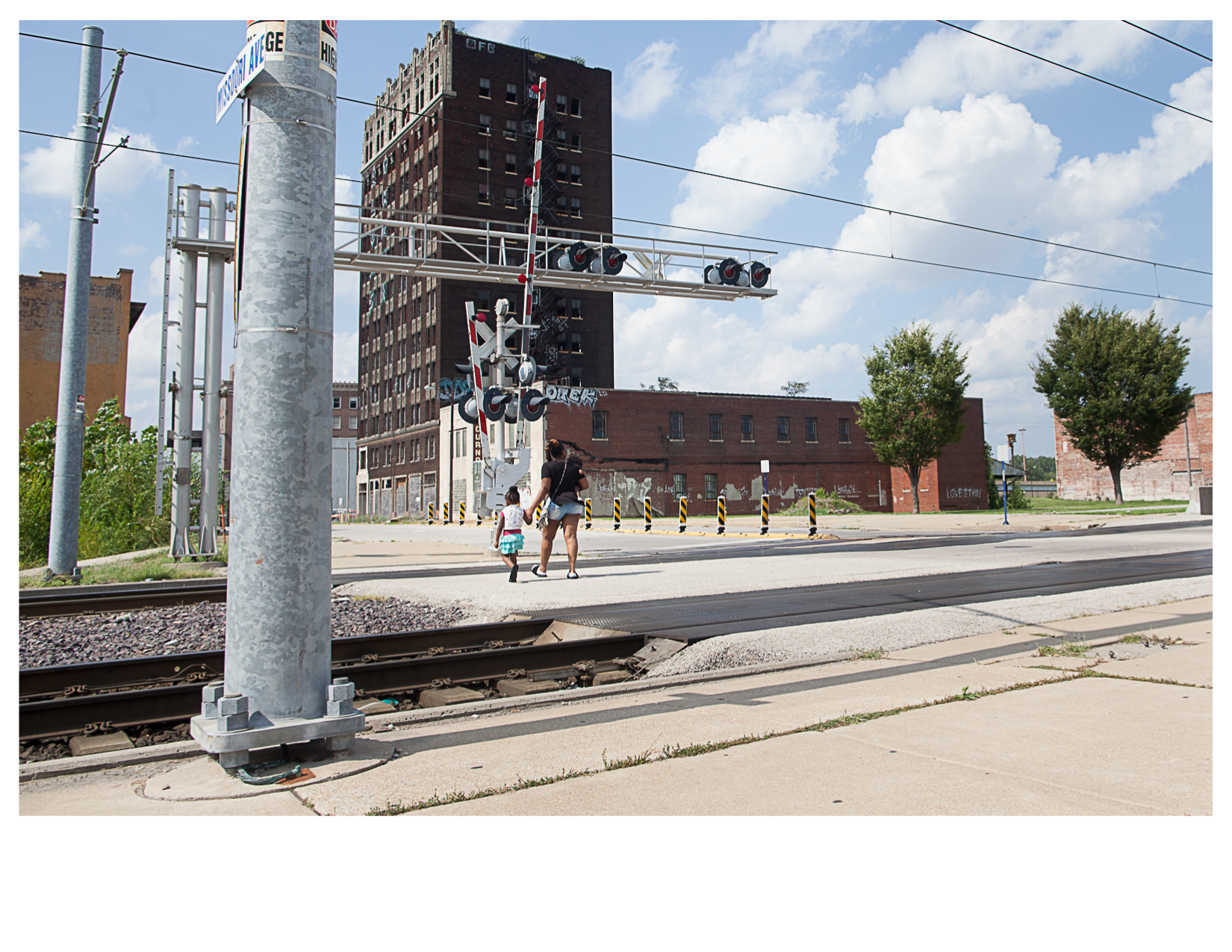 Family on Missouri Avenue near Metrolink Train Station, East St. Louis, IL