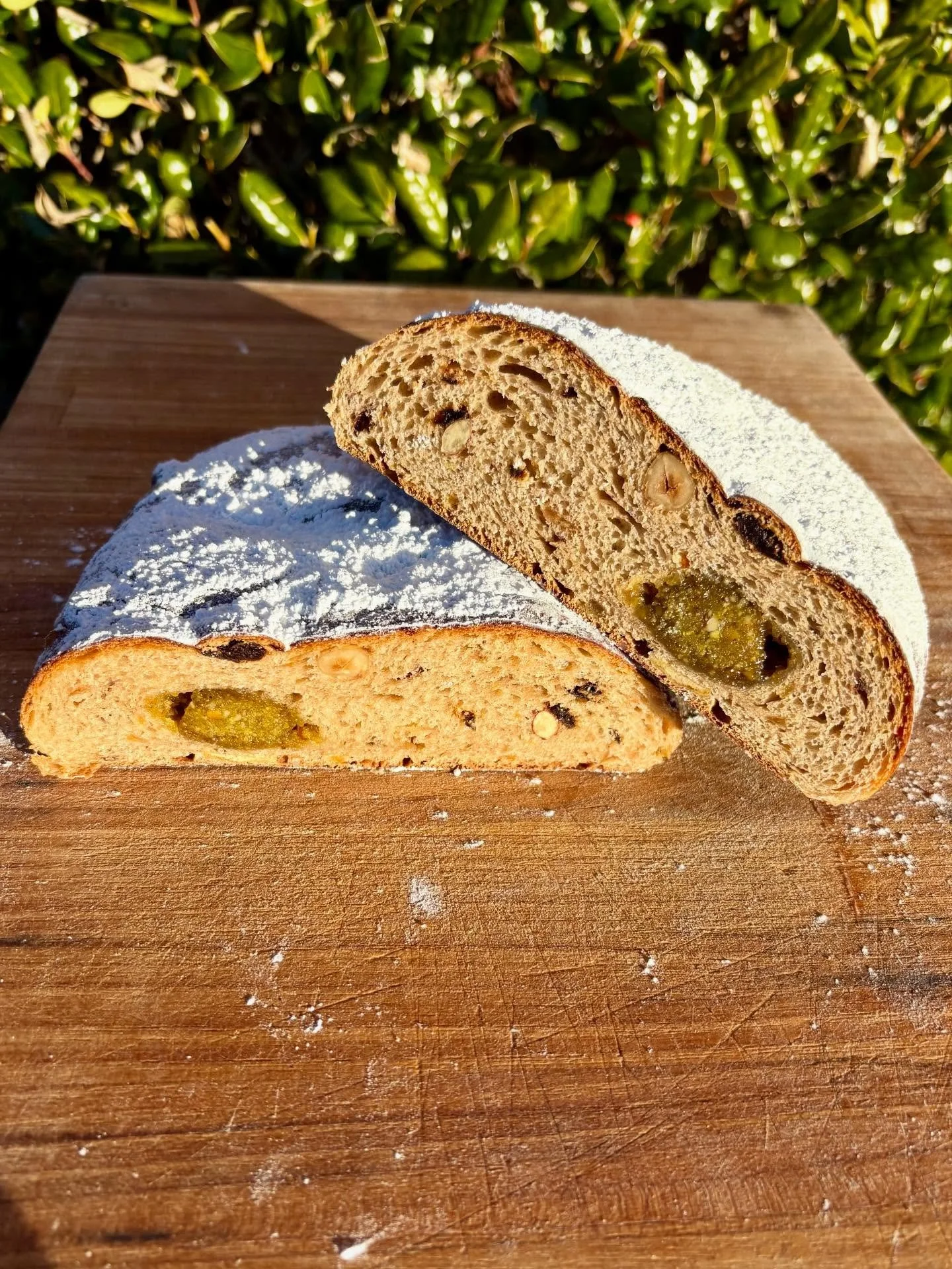 STOLLEN AND CARDAMOM BRAID AVAILABLE MONDAY, TUESDAY, AND WEDNESDAY THIS WEEK

Pic 1 is stollen- a German fruit bread with rum soaked nuts, fruits, and candied citrus peel. Traditionally it has a marzipan log, but ours has a pistachio log through the