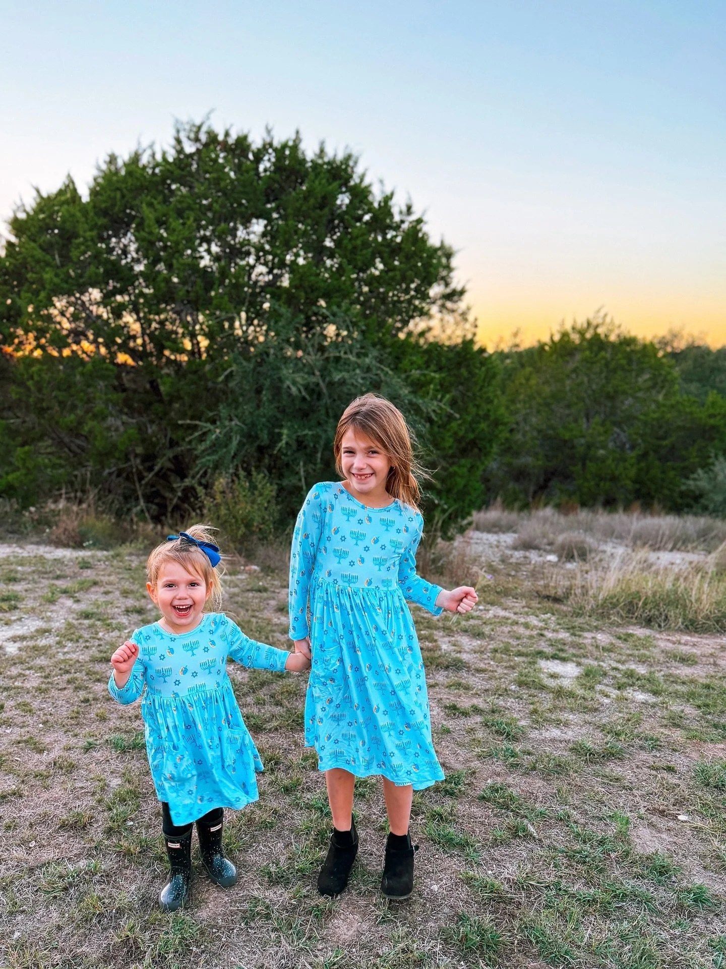 Hanukkah starts in one month, on December 14th! 🕎 I am thrilled we get to celebrate before Christmas this year.  An earlier Hanukkah also means more days for sparkles, sister twirls, and teaching traditions. 💙 Swipe to see big sis teaching little s