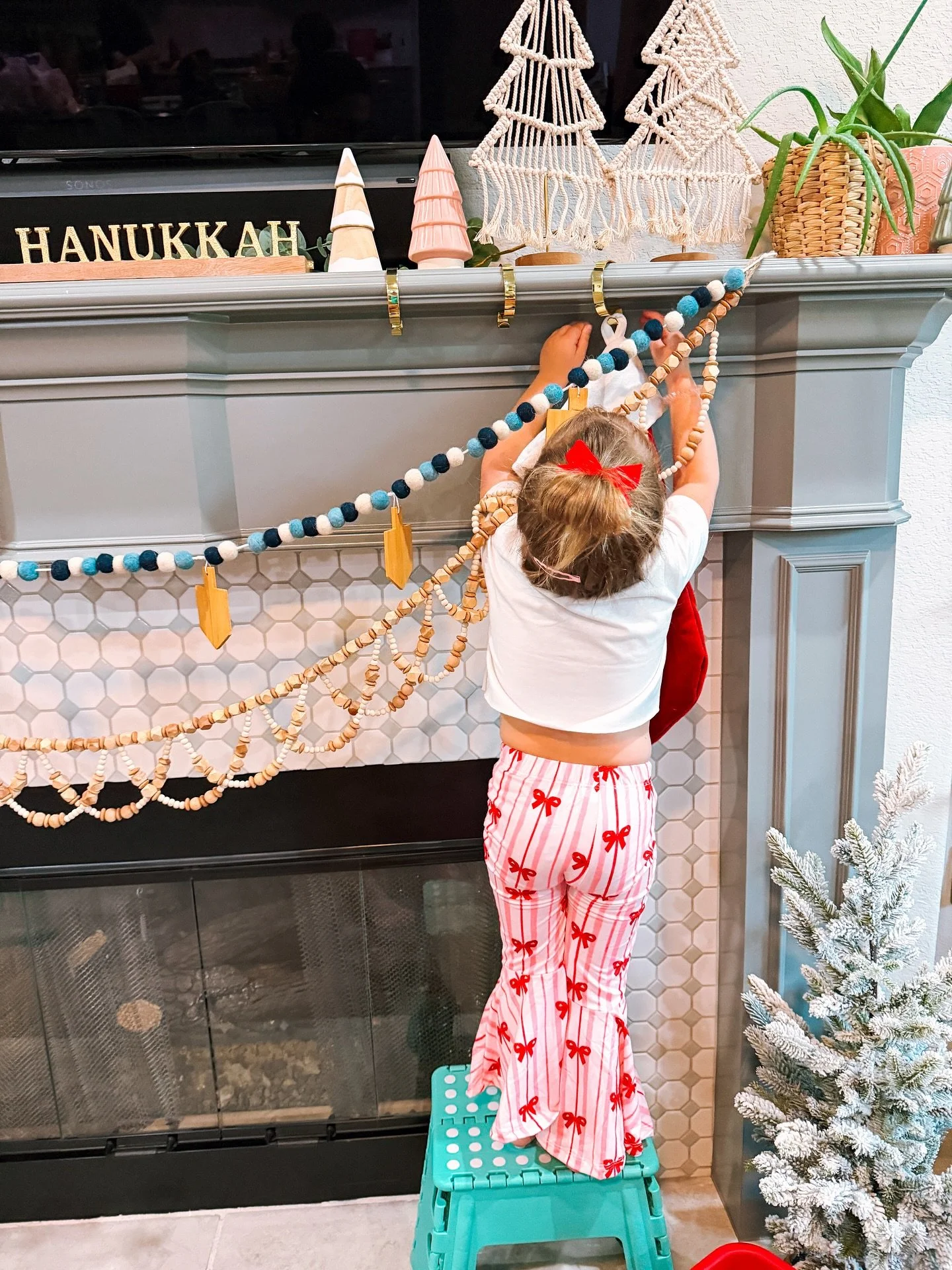Bows, bellbottoms, and Christmukkah cheer &mdash; these two are ready! 🎀 We&rsquo;re decorating slowly but surely over here. Scroll to the end to see their mischief. 🙃 Adorable outfits are @baileysblossoms. 💕