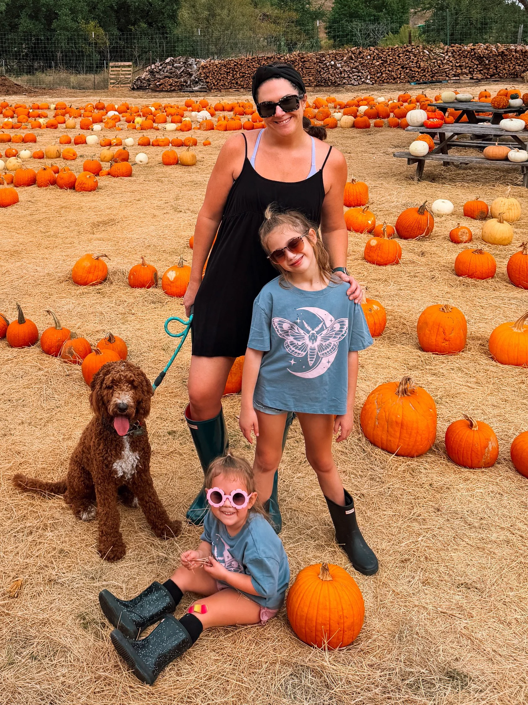 Girls in matching PixieLane tees at a pumpkin patch