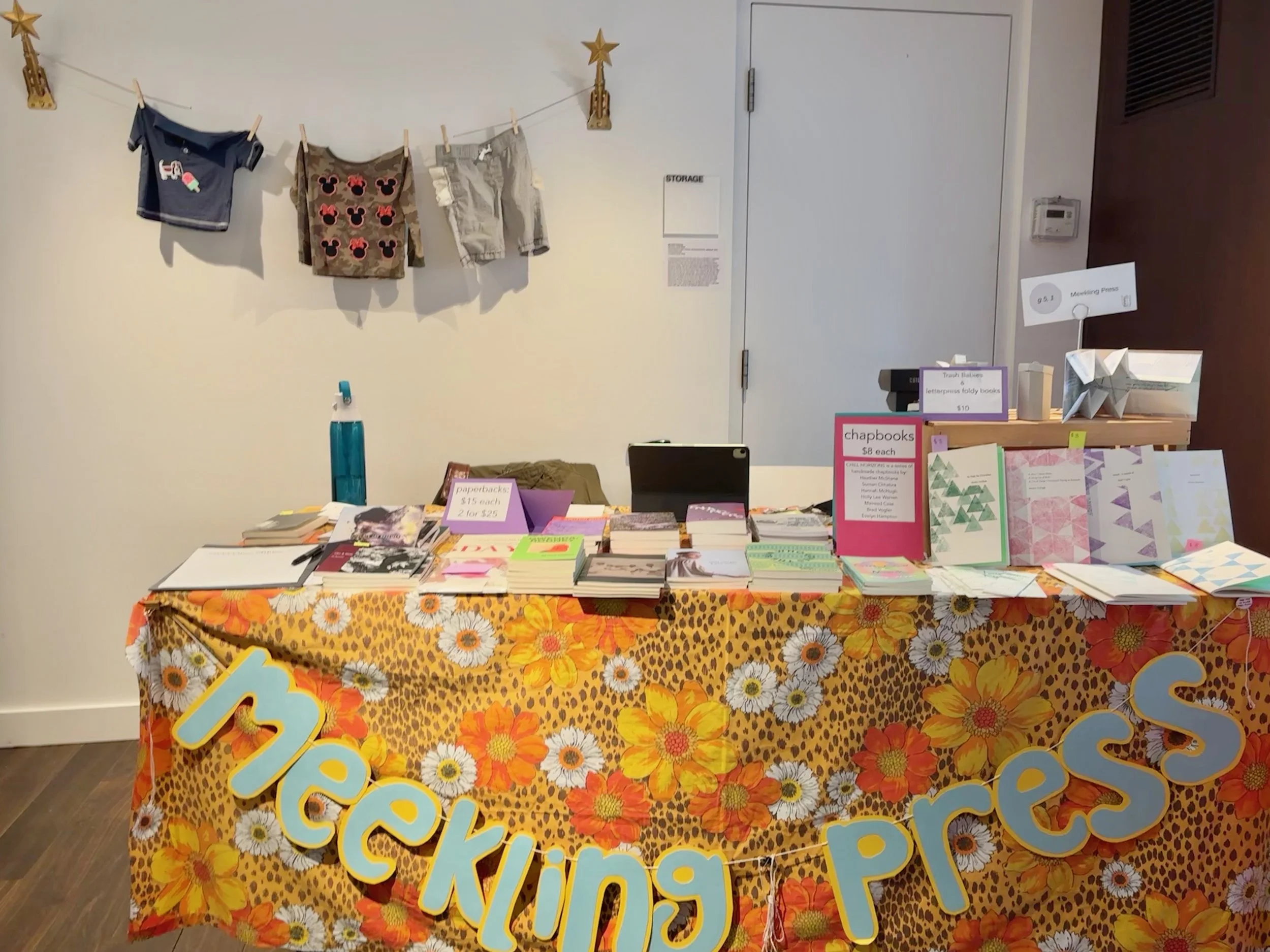the meekling press table at a chicago bookfair. jay besemer's MEN AND SLEEP is stacked at the left corner.