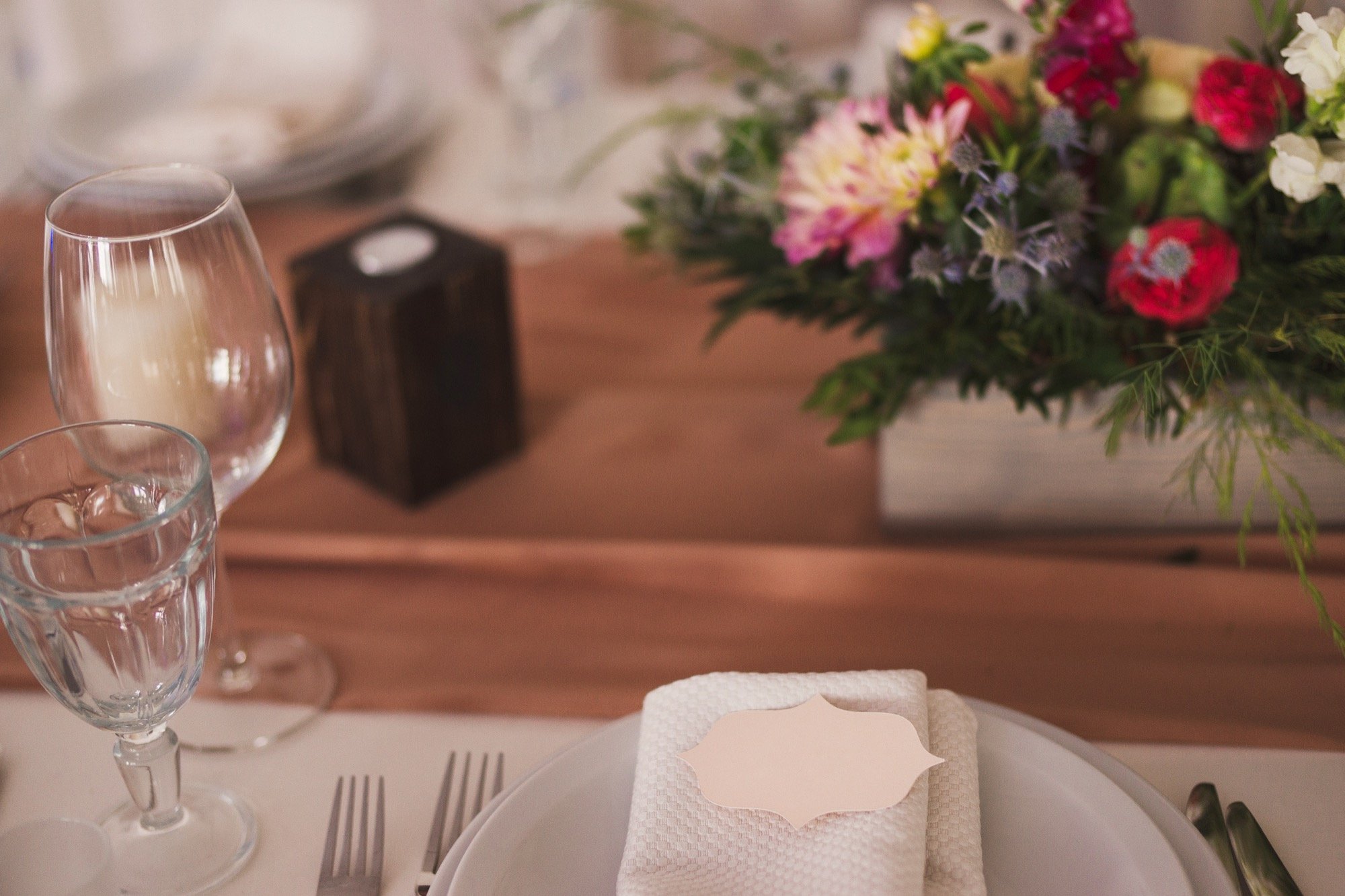 Wedding reception table setting with floral decoration