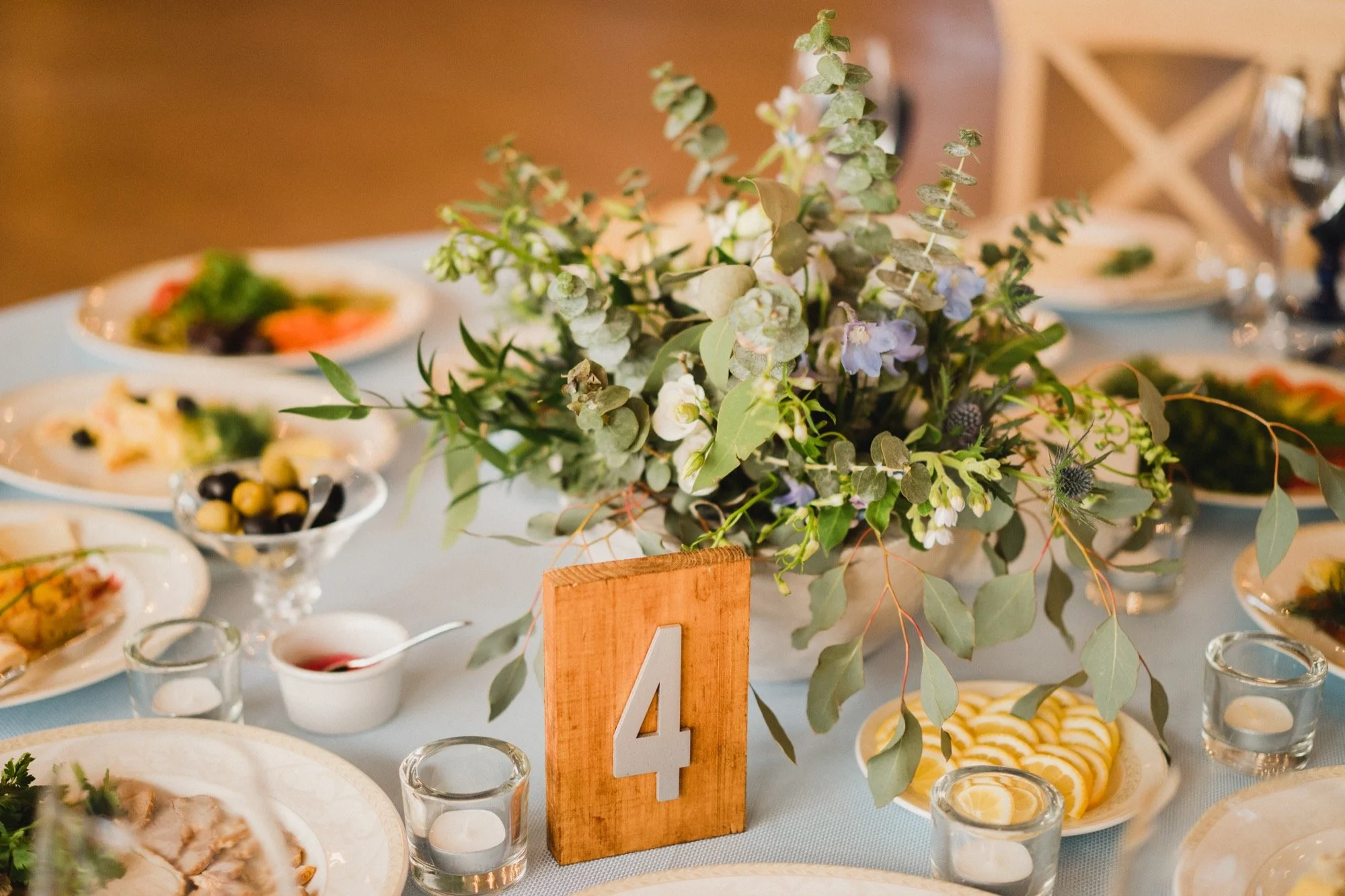 Floral decoration and place card at a wedding table setting